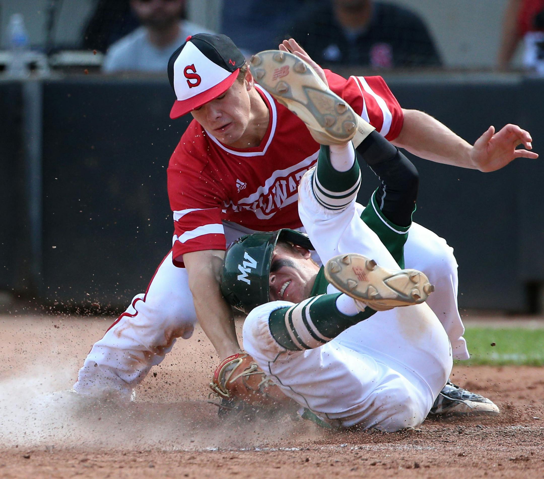 Stillwater pitcher Andrew Gilbet (1) tagged out Mounds View short stop Joey Lawson (6) as he attempted to slide into home in the fourth inning. ] ALEX KORMANN • alex.kormann@startribune.com The Stillwater high school baseball team defeated Mounds View 3-2 with a game winning single in the bottom of the 7th inning of the AAAA quarter-finals on Thursday June 14, 2018.