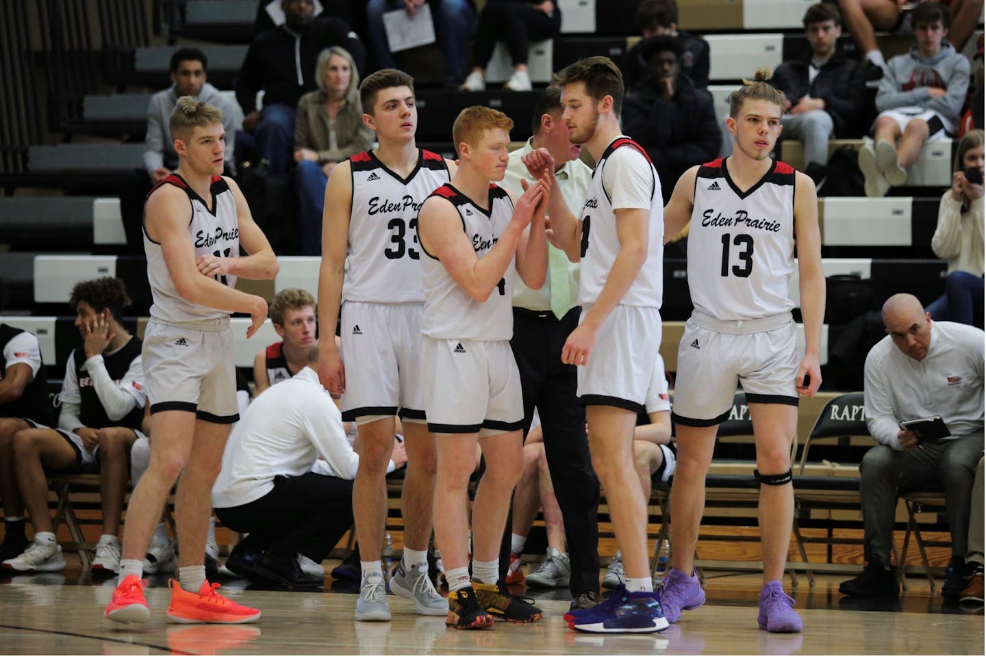 Eden Prairie players Drake Dobbs, Austin Andrews, Will Foster, Connor Christensen and John Henry gathered before a December game at East Ridge. The Eagles finished with a 28-0 record in a season ended early by the pandemic.