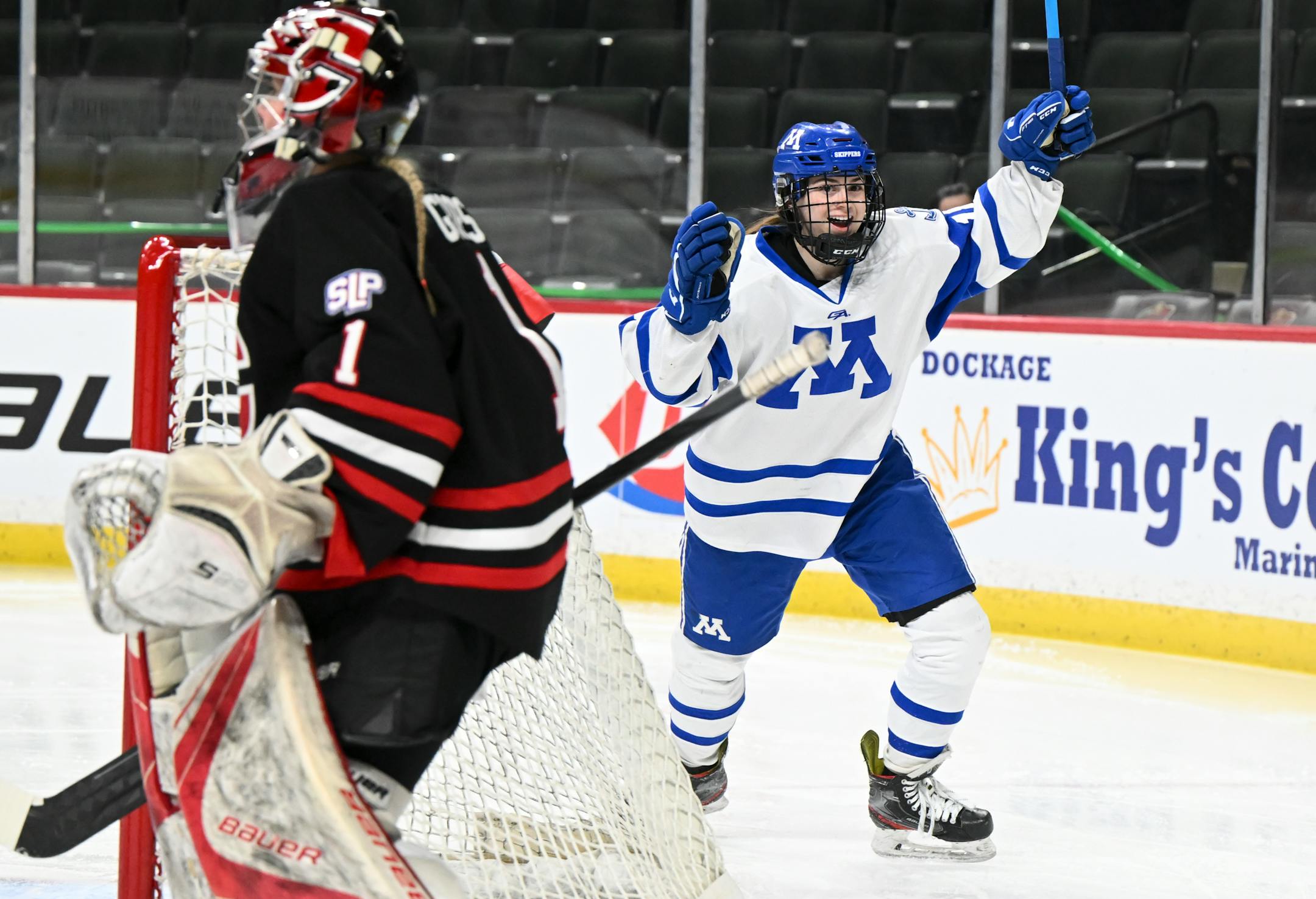 Minnetonka forward Ruby Rauk (18) celebrates after scoring a goal against Centennial/Spring Lake Park goaltender Kaitlin Groess (1) during the first period.