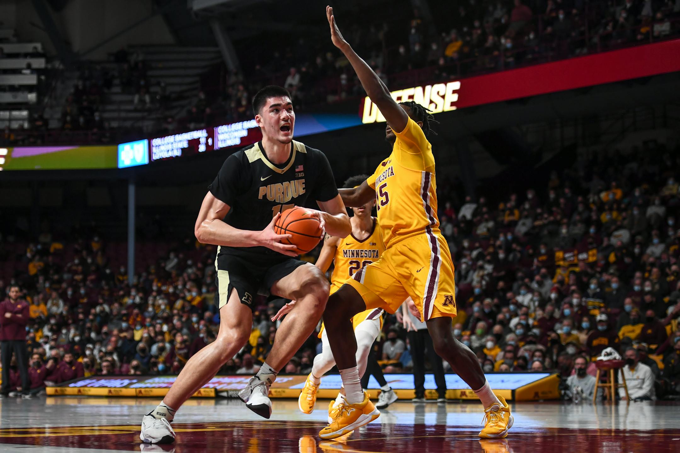 Purdue Boilermakers center Zach Edey (15) drives towared the basket against Minnesota Gophers forward Charlie Daniels (15) during the second half of an NCAA men's basketball game between Minnesota and Purdue at Williams Arena in Minneapolis, Minn.