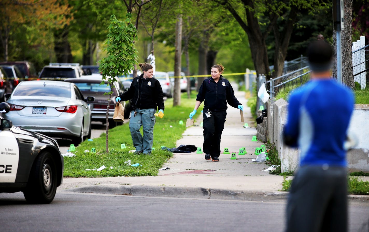 The scene on Thursday morning where one person was shot dead and at least two others were in critical condition after seven people were shot Wednesday night in north Minneapolis.