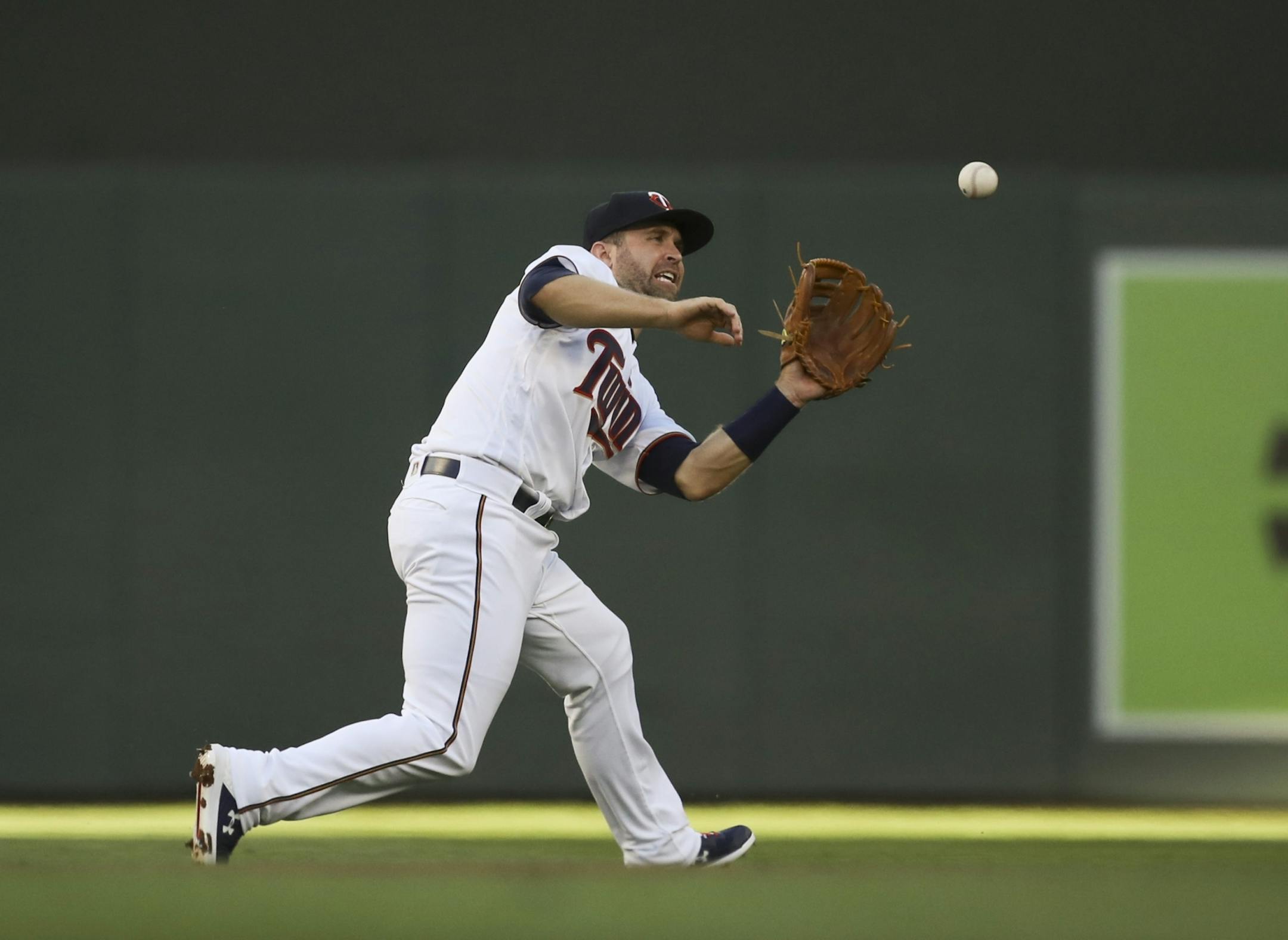 Minnesota Twins second baseman Brian Dozier (2) fielded a hit by the Orioles' Danny Valencia in the second inning for an out.