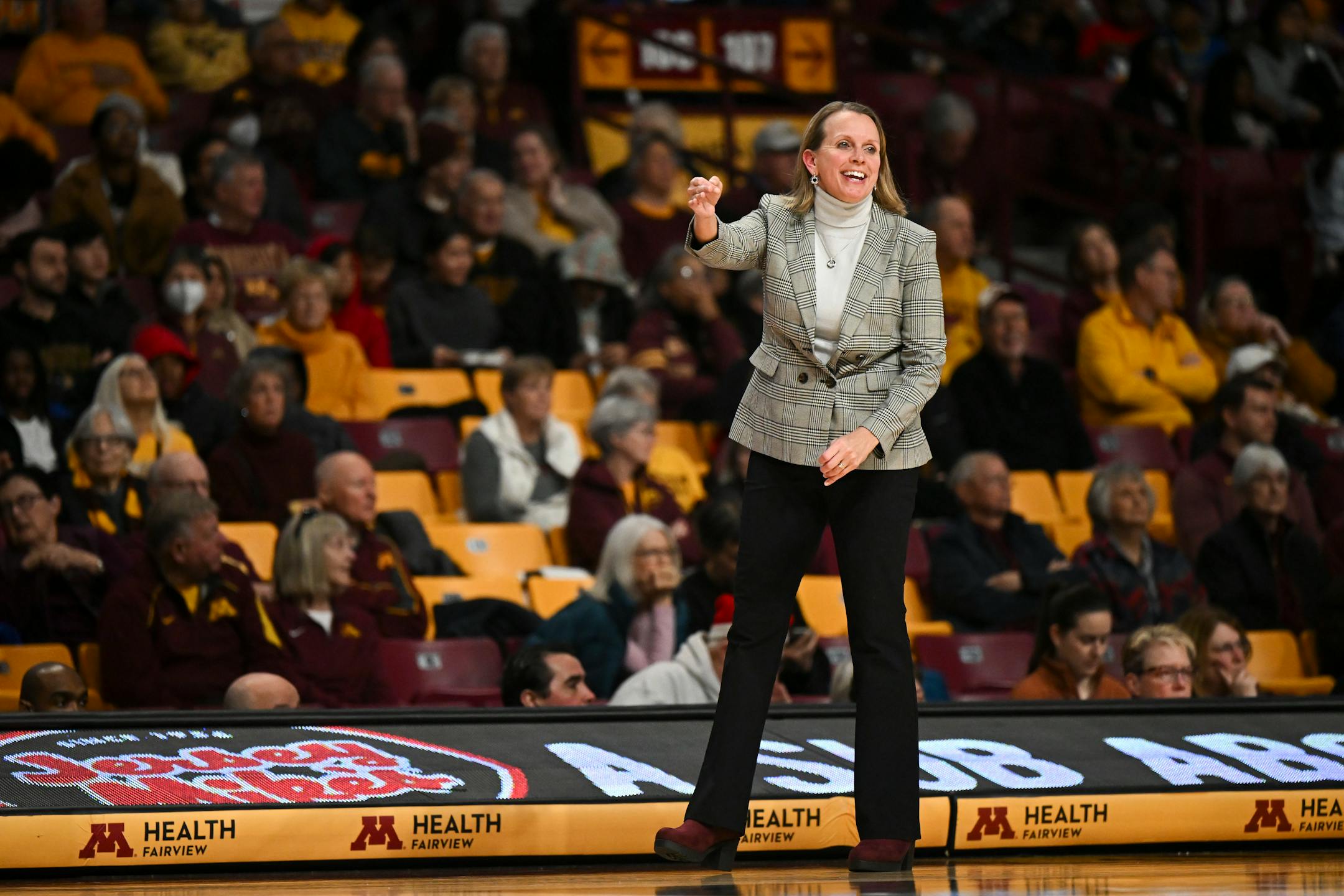 Minnesota Gophers head coach Dawn Plitzuweit directs the team against the Grambling Lady Tigers in the second half.