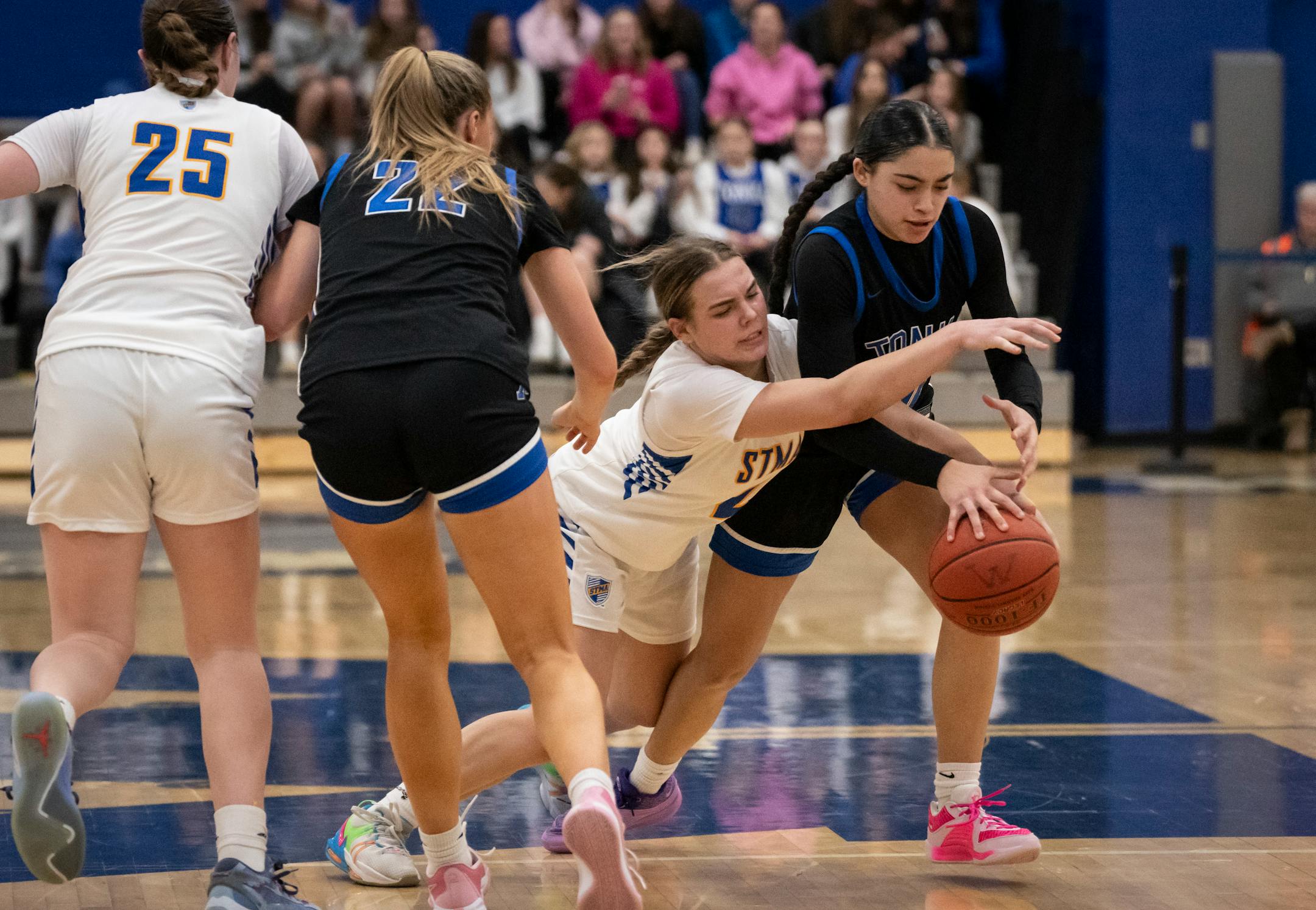 St. Michael/Albertville's Kaylie Cox (2) tries to steal the ball from St. Michael-Albertville's Lanelle Wright (10) in the second half. Minnetonka High School hosted St. Michael-Albertville, both undefeated Class 4A girls basketball teams, on Friday, Jan. 12, 2024 in Minnetonka, Minn. Minnetonka won 63-54. ] RENEE JONES SCHNEIDER • renee.jones@startribune.com