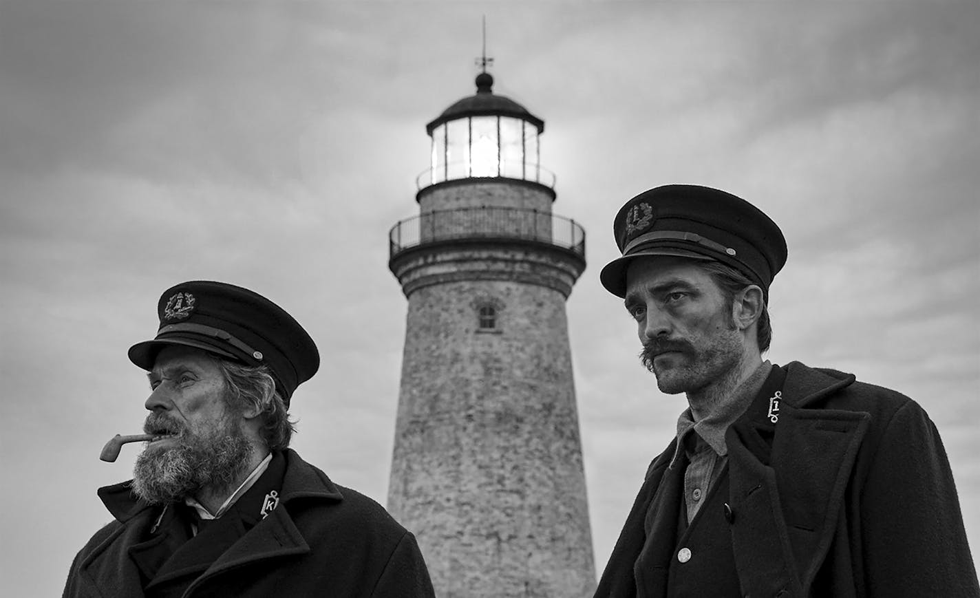 This image released by A24 Films shows Willem Dafoe, left, and Robert Pattinson in a scene from "The Lighthouse." Amazon Prime has Robert Eggers&#x2019; &#x201c;The Lighthouse,&#x201d; available starting Thursday. (Eric Chakeen/A24 Pictures via AP)