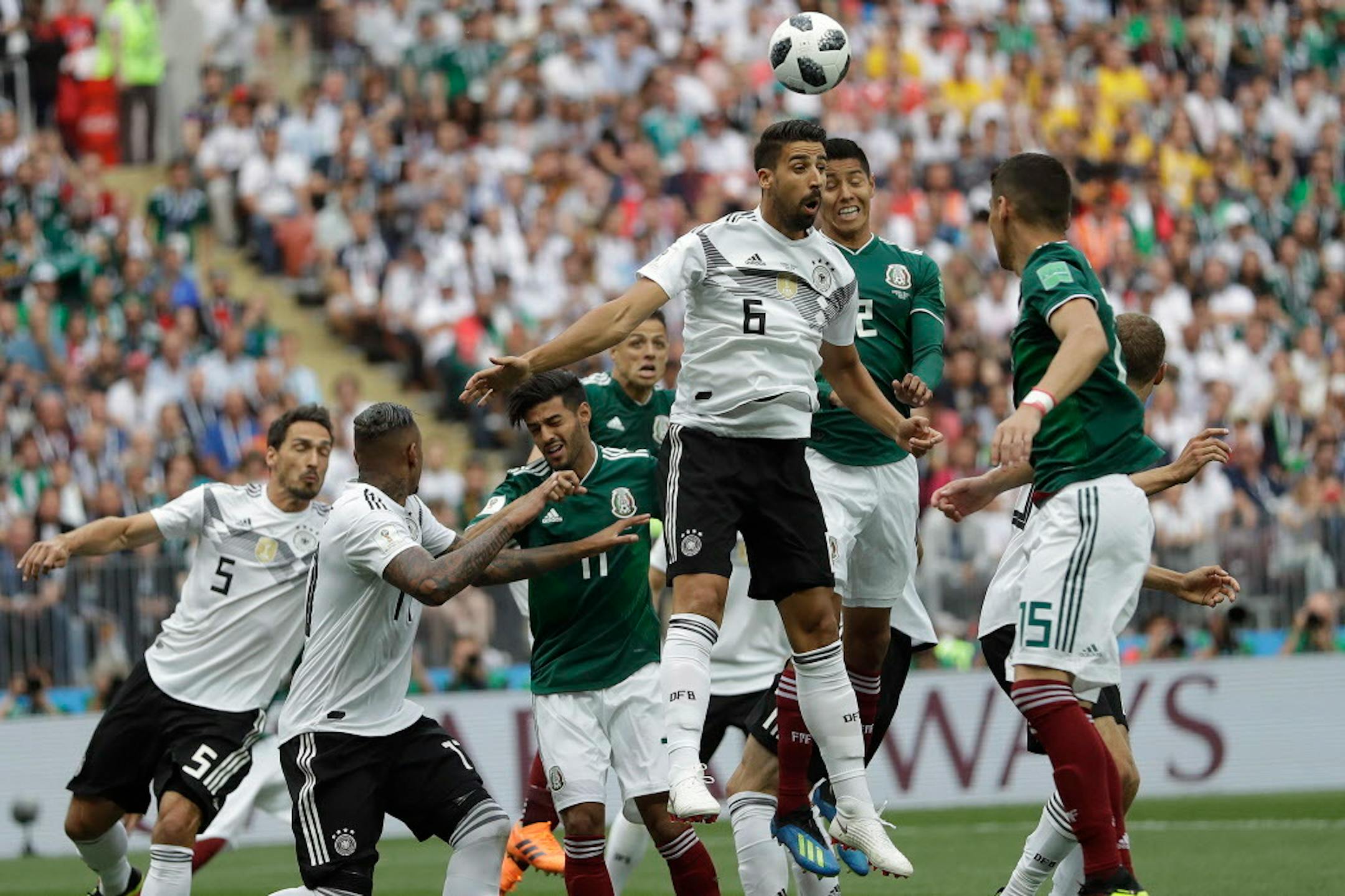 Germany's Sami Khedira, third from right, and Mexico's Hirving Lozano challenge for the ball during the group F match between Germany and Mexico at the 2018 soccer World Cup in the Luzhniki Stadium in Moscow, Russia, Sunday, June 17, 2018. (AP Photo/Matthias Schrader)