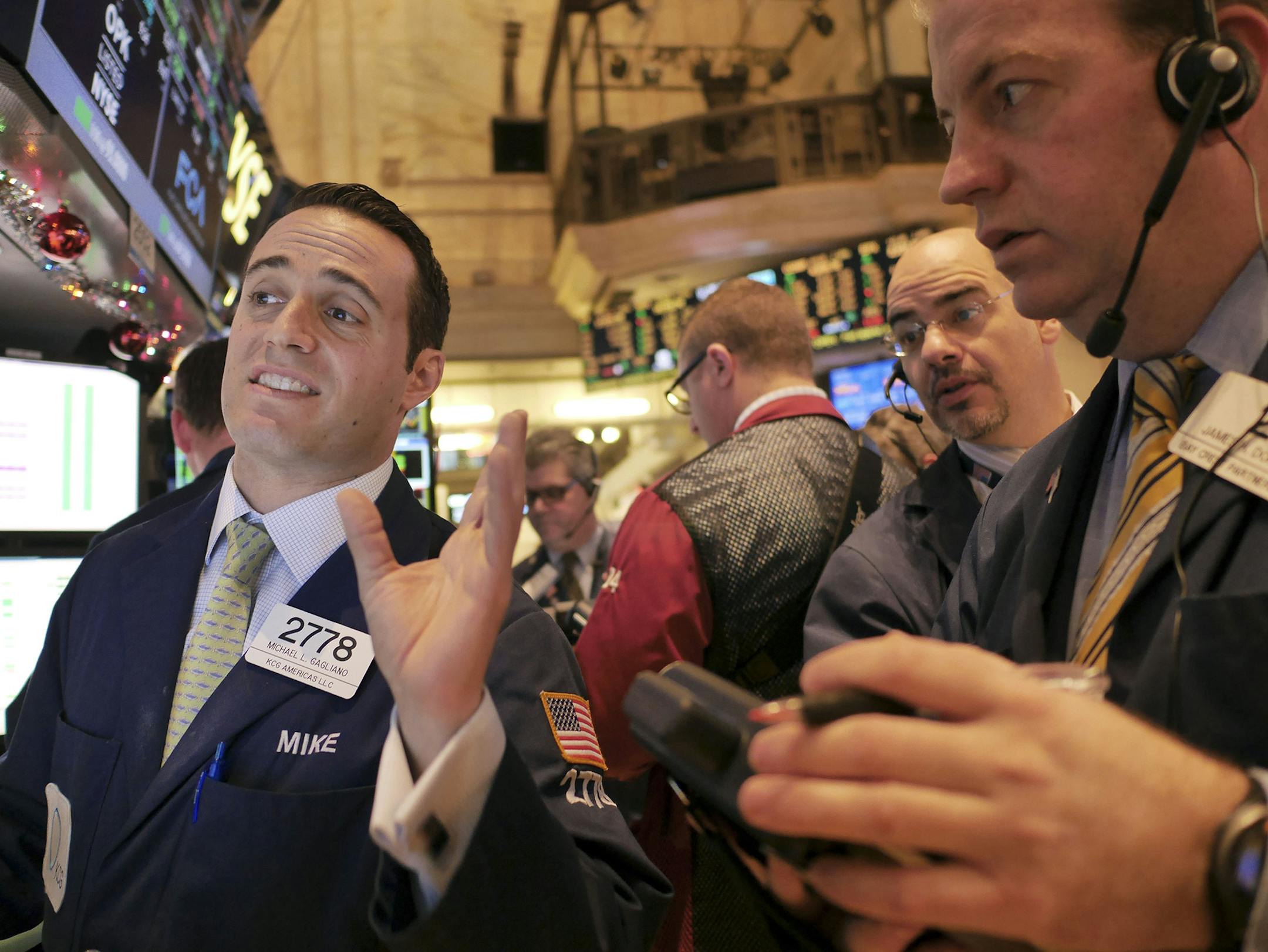Traders work on the floor at the New York Stock Exchange in New York, Thursday, Dec. 18, 2014. The market is opening sharply higher, building on gains from the day before after the Federal Reserve indicated it was in no rush to raise interest rates. (AP Photo/Seth Wenig) ORG XMIT: MIN2014121815582419
