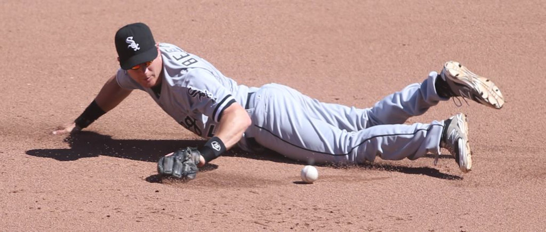 Chicago's Gordon Beckham knocked down a ball hit by Minnesota's Kendrys Morales in the 7th inning, who was thrown out at first base on the play.