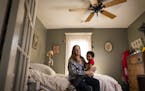 Kris Gronquist, with 3-year-old grandson Tia'aj White, is trying to get her vintage ceiling fans repaired.