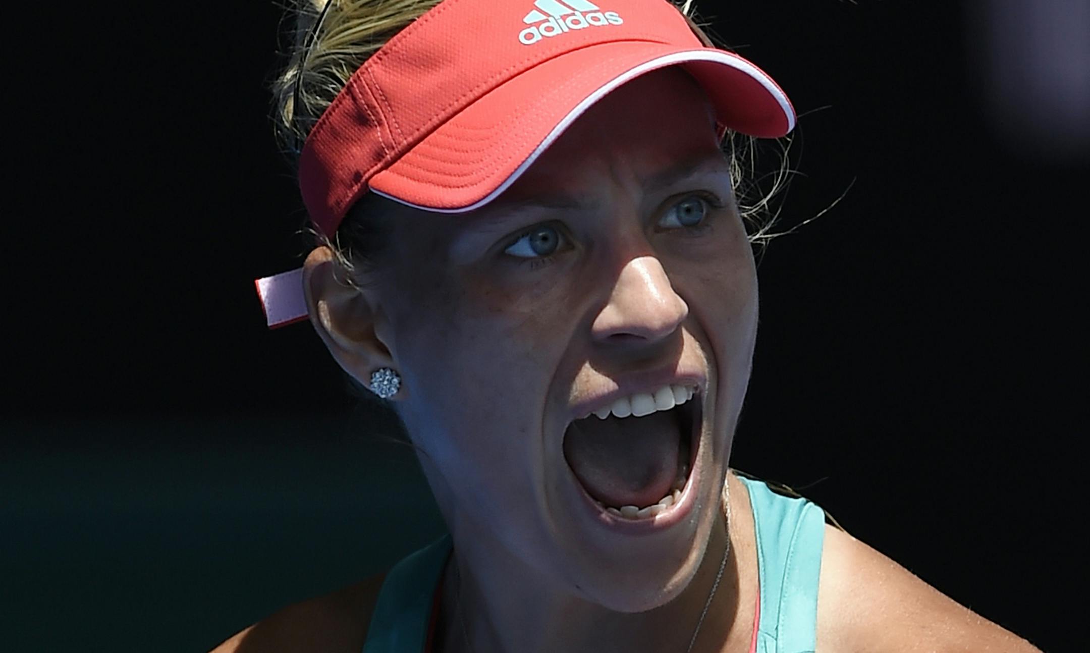 Angelique Kerber of Germany reacts after winning a point against Victoria Azarenka of Belarus during their quarterfinal match at the Australian Open tennis championships in Melbourne, Australia, Wednesday, Jan. 27, 2016.(AP Photo/Andrew Brownbill)