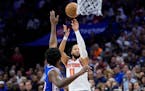 Knicks guard Jalen Brunson shoots over 76ers center Joel Embiid during Game 6 on Thursday. Brunson had 41 points and 12 assists in New York's series-c