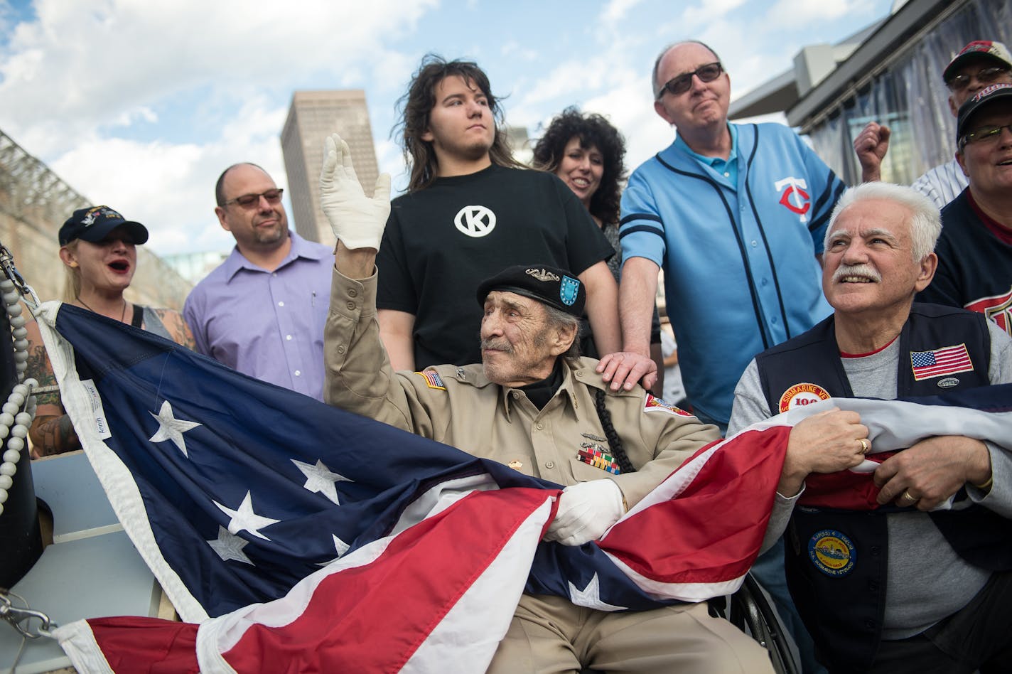 Surrounded by friends, family and members of the Minnesota Submarine League, Stan Kowalski looked on before raising the American flag at Friday night&#x2019;s Twins game.