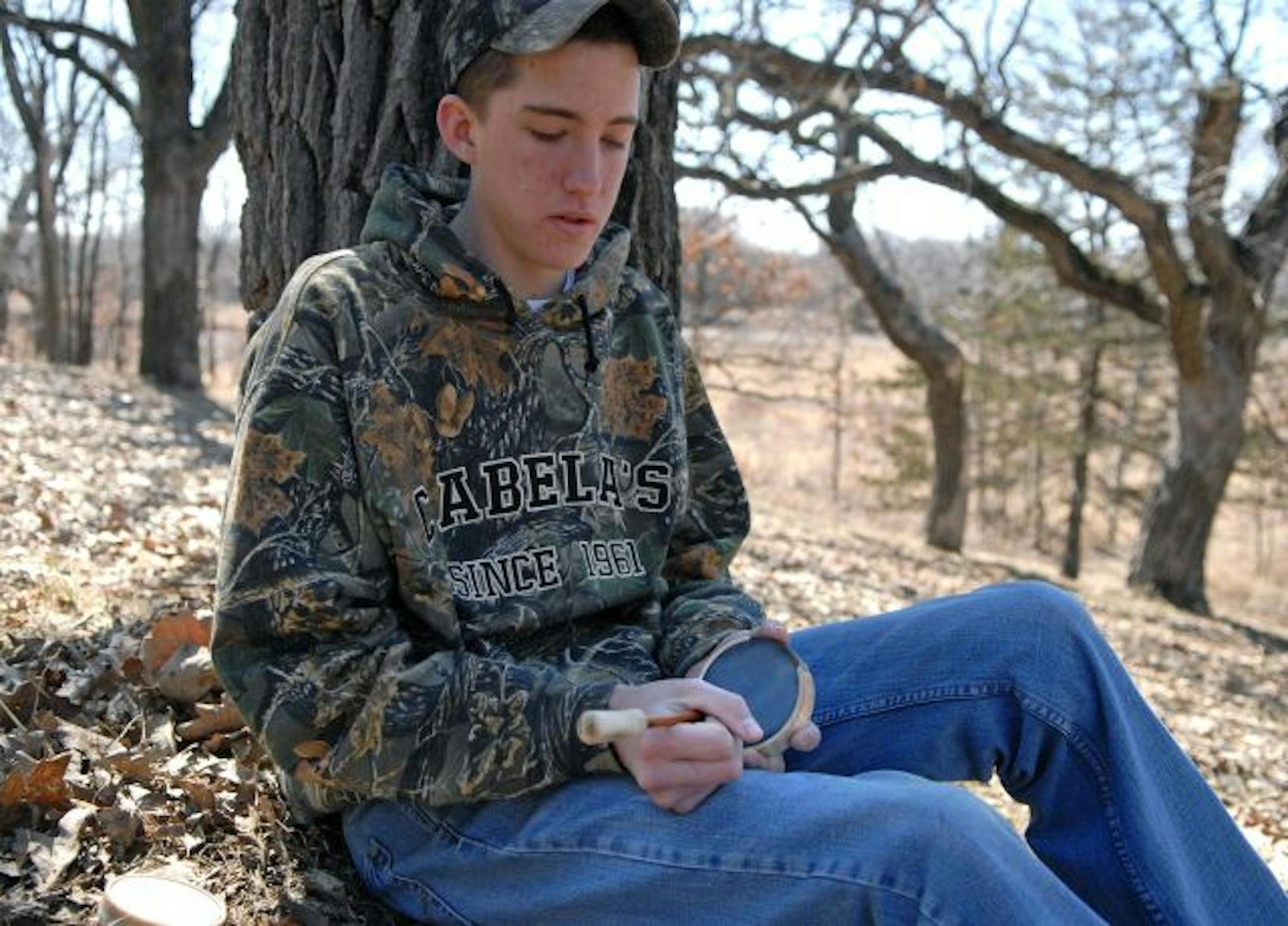 Kevin Croteau is only 16, but he's an avid outdoorsman and an accomplished turkey call maker. Here he struck some notes on one of his friction calls.
