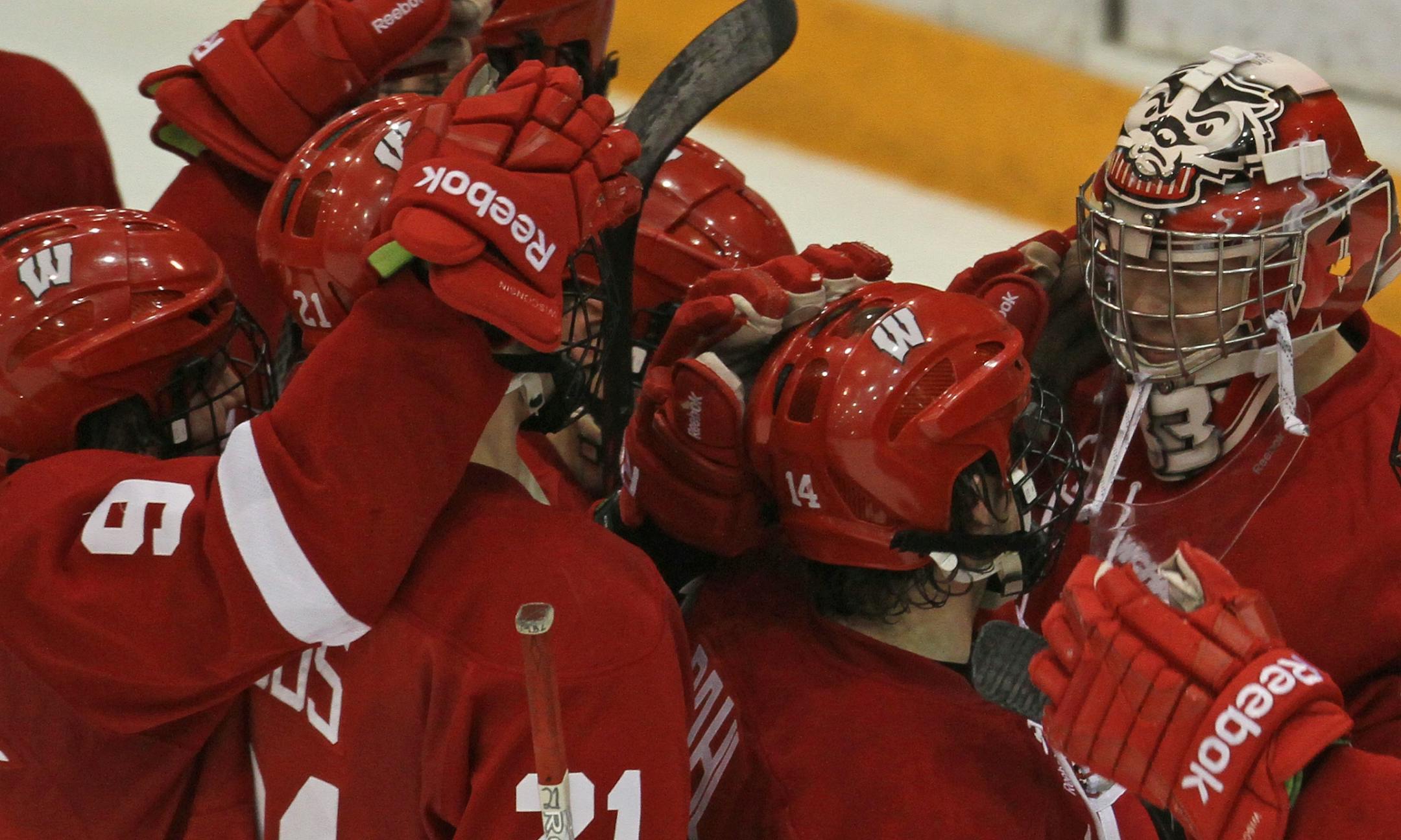 Minnesota Hockey vs Wisconsin, 3/2/12. (left to right) Wisconsin goalie Joel Rumpel and the Badgers celebrated their 4 to 1 win over the Gophers.