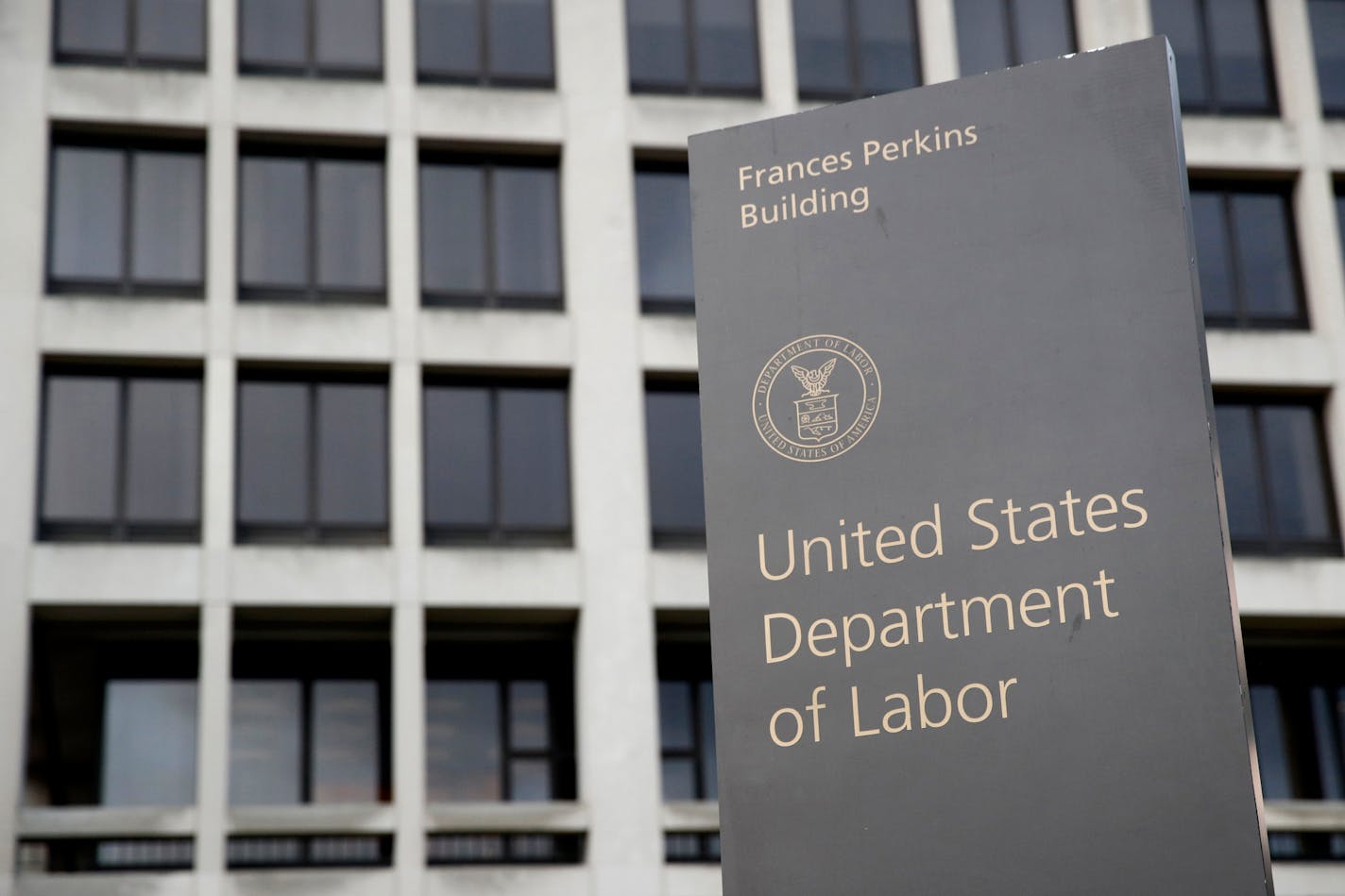 FILE - In this May 6, 2020, file photo, a sign stands outside the Department of Labor's headquarters in Washington. A government watchdog has found that the Labor Department's widely watched weekly unemployment benefits data are providing an inaccurate reading on the number of newly laid off workers because of flaws in the government's data collection. (AP Photo/Patrick Semansky, File)