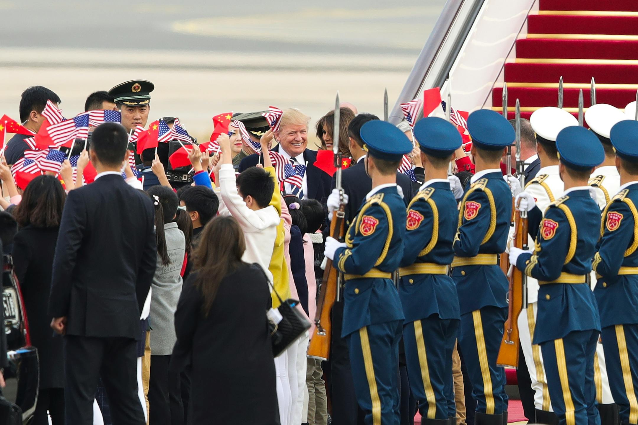 U.S. President Donald Trump and first lady Melania Trump arrive in Beijing, China, Wednesday, Nov. 8, 2017. (Lintao Zhang/Pool Photo via AP)