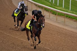 Kentucky Derby hopefuls Dornoch, front, and Endlessly work out at Churchill Downs earlier this week in advance of Saturday's race.