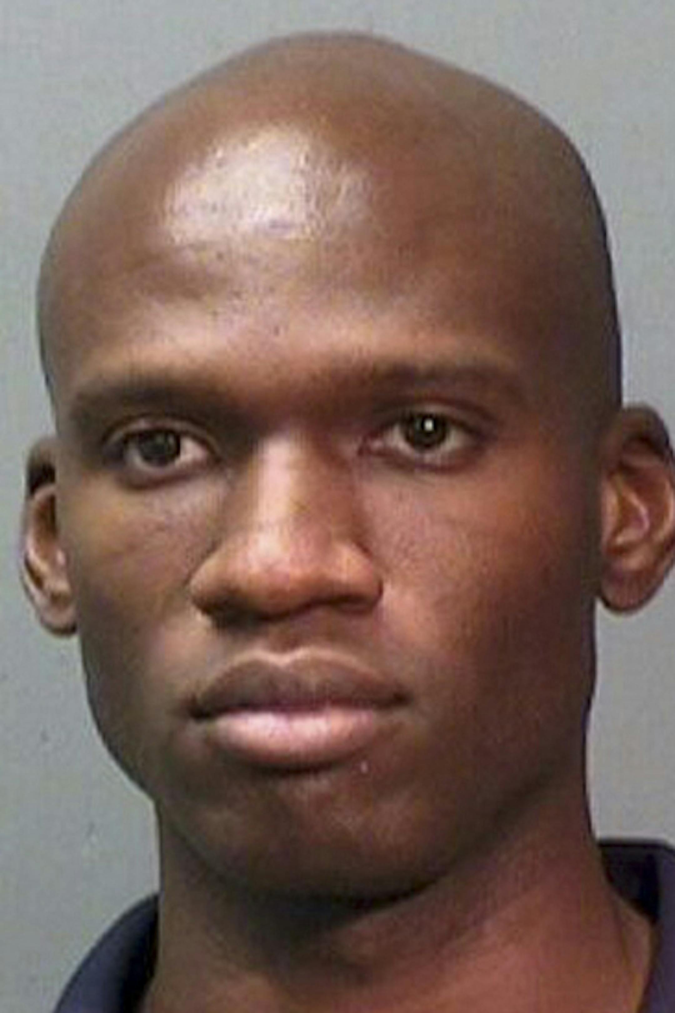 A 2010 booking photo of Aaron Alexis released by the Fort Worth Police Department on Monday, Sept. 16, 2013. Law enforcement officials on Tuesday were trying to piece together a motive for a shooting rampage by the former Navy reservist at the secure military facility near the Capitol on Monday that left at least 13 people dead, including the gunman Alexis, who the police say acted alone. (Fort Worth Police Department via the New York Times) -- FOR EDITORIAL USE ONLY ORG XMIT: MIN201309171420275