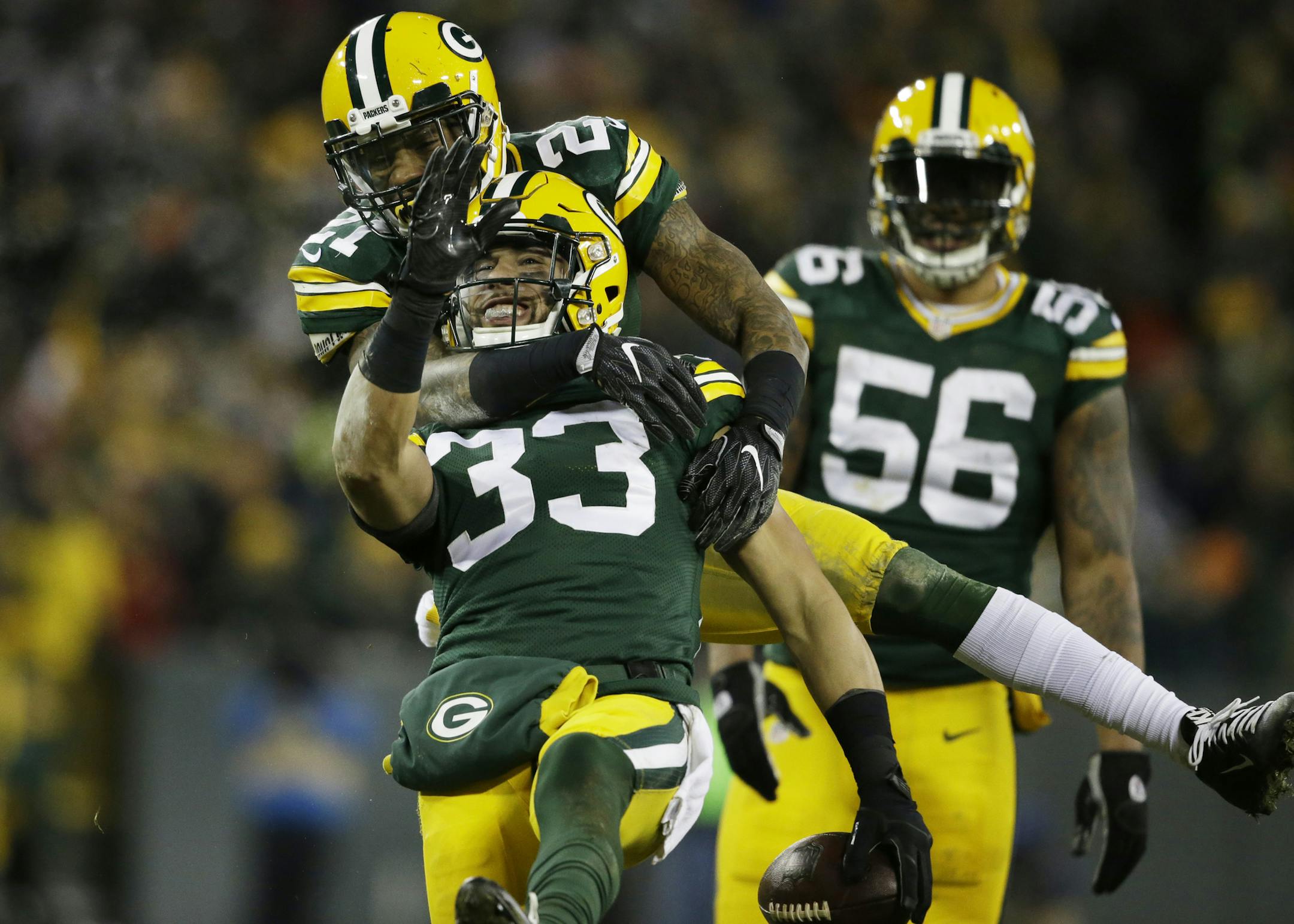 Green Bay Packers' Ha Ha Clinton-Dix congratulates teammate Micah Hyde (33) after Hyde's interception during the second half of an NFL football game against the Seattle Seahawks Sunday, Dec. 11, 2016, in Green Bay, Wis. (AP Photo/Jeffrey Phelps)