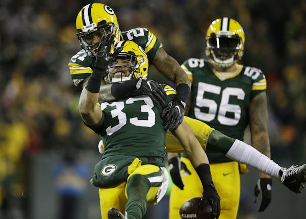 Green Bay Packers' Ha Ha Clinton-Dix congratulates teammate Micah Hyde (33) after Hyde's interception during the second half of an NFL football game a