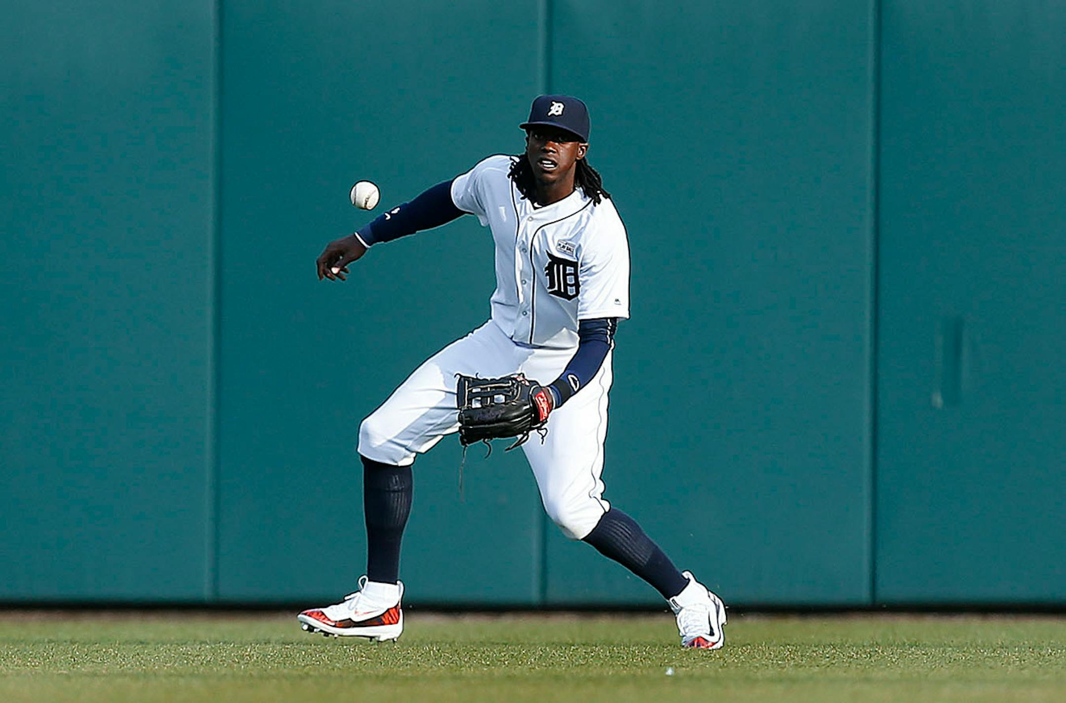 Detroit Tigers center fielder Cameron Maybin watches a Minnesota Twins' Eduardo Nunez (9) single land in front of him in the first inning of a baseball game, Monday, May 16, 2016 in Detroit.