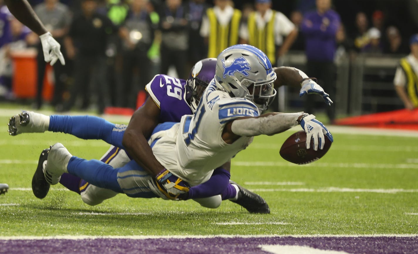 Detroit Lions running back Ameer Abdullah (21) scores from the 2-yard line as he was nearly stopped by Minnesota Vikings cornerback Xavier Rhodes (29) in the third quarter on Sunday, Oct. 1, 2017 at U.S. Bank Stadium in Minneapolis, Minn. Officials initially ruled him down by contact, but a Detroit challenge gave the Lions what proved to be the winning touchdown. (Jeff Wheeler/Minneapolis Star Tribune/TNS) ORG XMIT: 1212333