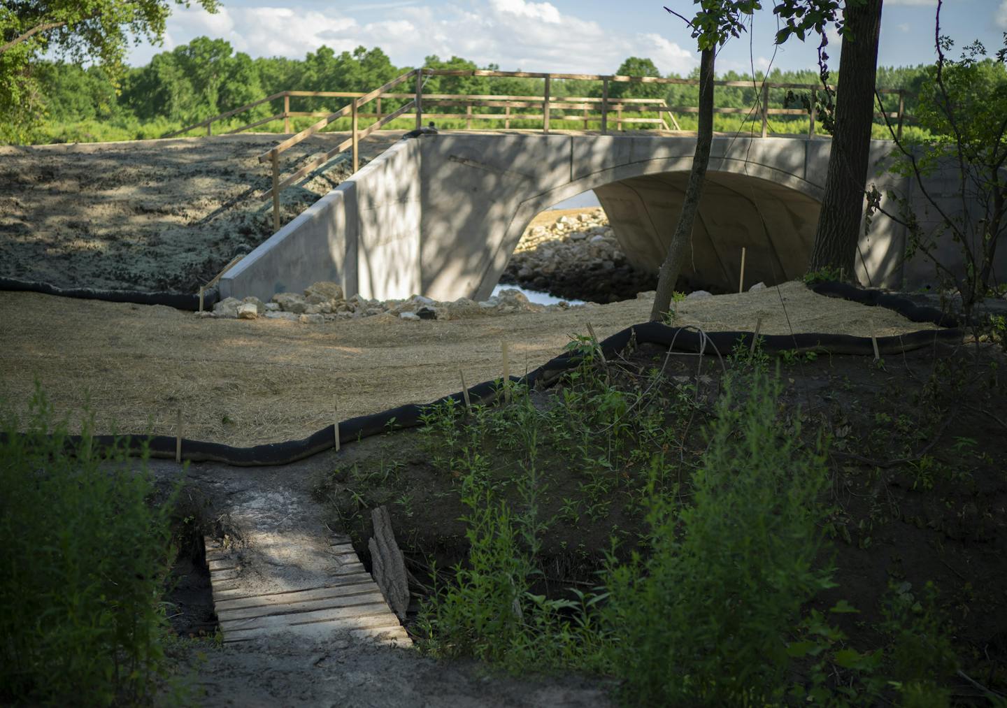 A new bridge over a stream that runs into the Minnesota River will lessen the need for the wooden one in the foreground. ] JEFF WHEELER • Jeff.Wheeler@startribune.com The Army Corps and U.S. Fish and Wildlife are starting a $4M project to restore water levels at four pools or lakes of the Minnesota River near the Twin Cities. The project is mainly to restore rare bird populations that need these wetlands. Bridges were under construction in the Long Meadow Lake Unit of the Minnesota Valley Nation