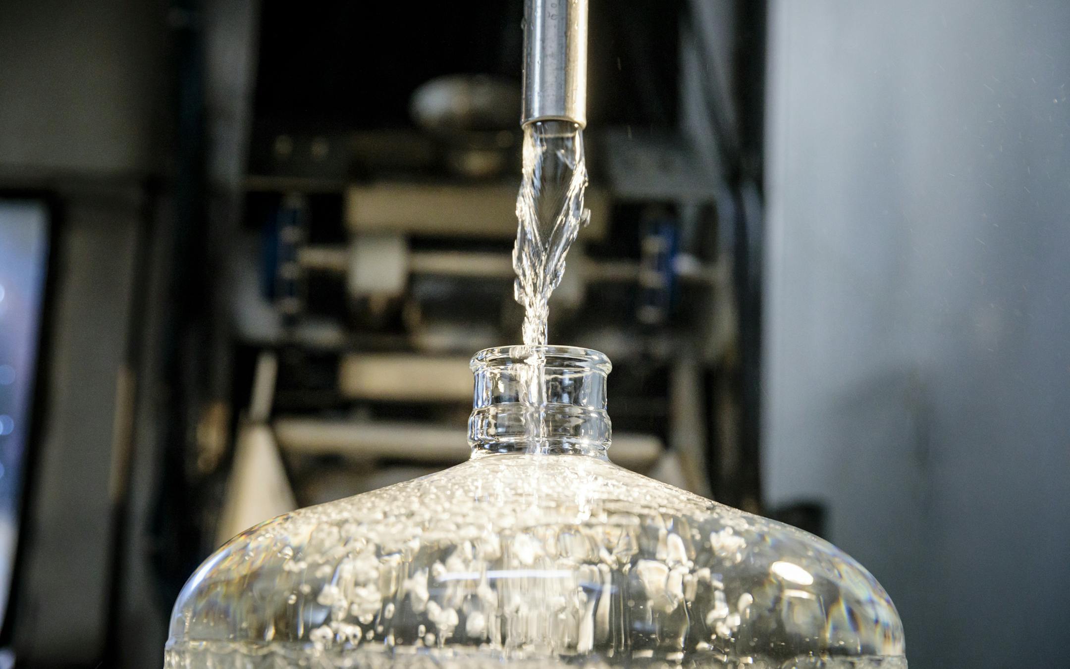 **EDS.: RETRANSMISSION OF XNYT23 SENT 01-02-18 TO ADD THE PHOTO CREDIT** Unfiltered, untreated, unsterilized spring water flows into a bottle at Opal Springs Water Company in Culver, Ore., Dec. 4, 2017. On the West Coast and in other pockets around the country, many people are looking to get off the water grid, and start-ups have emerged in the last few years to deliver untreated water on demand. (Leah Nash/The New York Times)