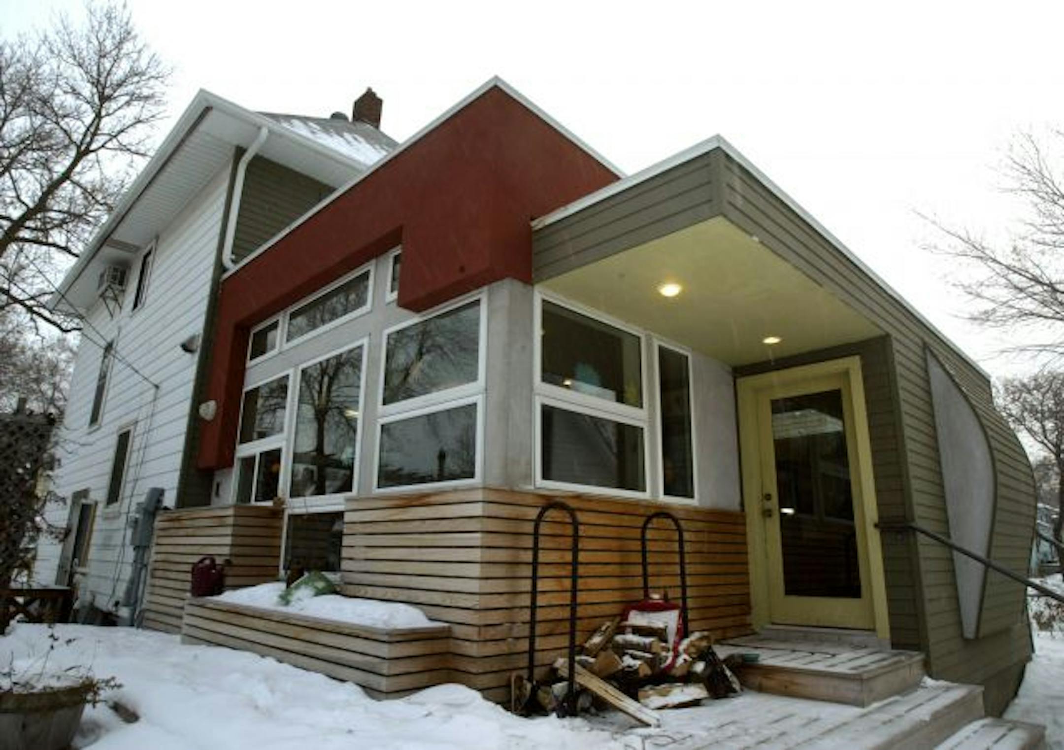 The addition's to Sara Langworthy's home features a "draped" form (right), a nod to Sara's work as a fiber artist. (Inside, it's a built-in bench.) The addition also gives Sara better access to her studio above the garage, where she operates a custom-sewing business.