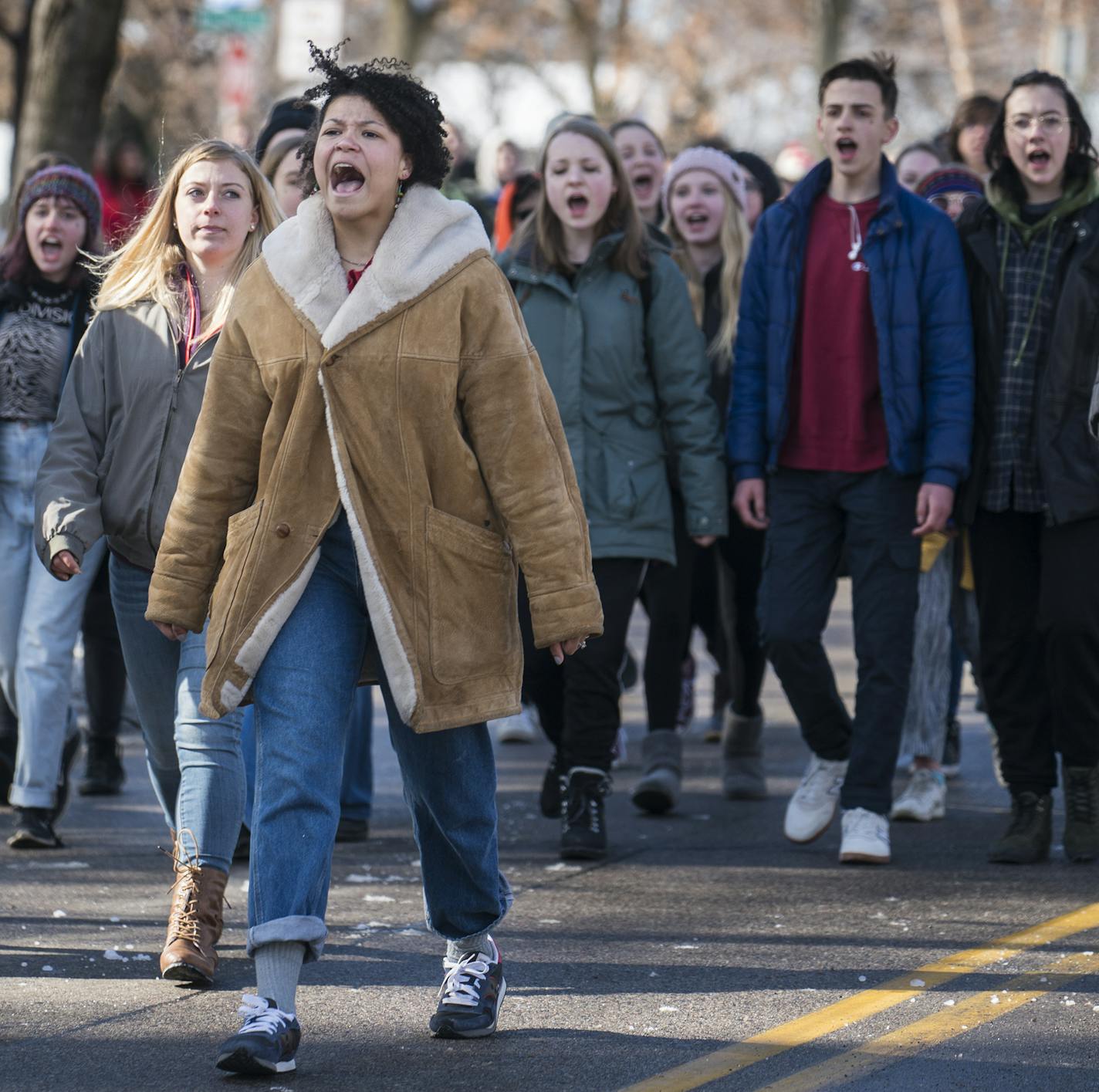 Several hundred high school student from Minneapolis including Leila Chaplin of Southwest H.S.marched to Minneapolis City Hall to rally for safer schools in the wake of the Florida shooting. "One of my jobs should not be to risk my life to save children," said Chaoplin(suede jacket) of teachers and herself as a future teacher.]High school students in Minneapolis plan to leave school mid-day then march to Minneapolis City Hall to rally for safer schools in wake of the Florida shooting.Richard Tso