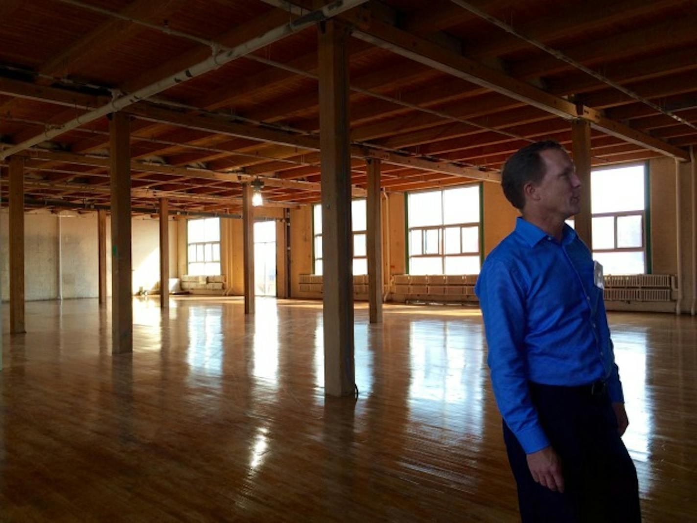 Charlie Nestor of Hillcrest Development gives a tour of an unleased space in the new Highlight Center. (photo: Kristen Leigh Painter/Star Tribune)