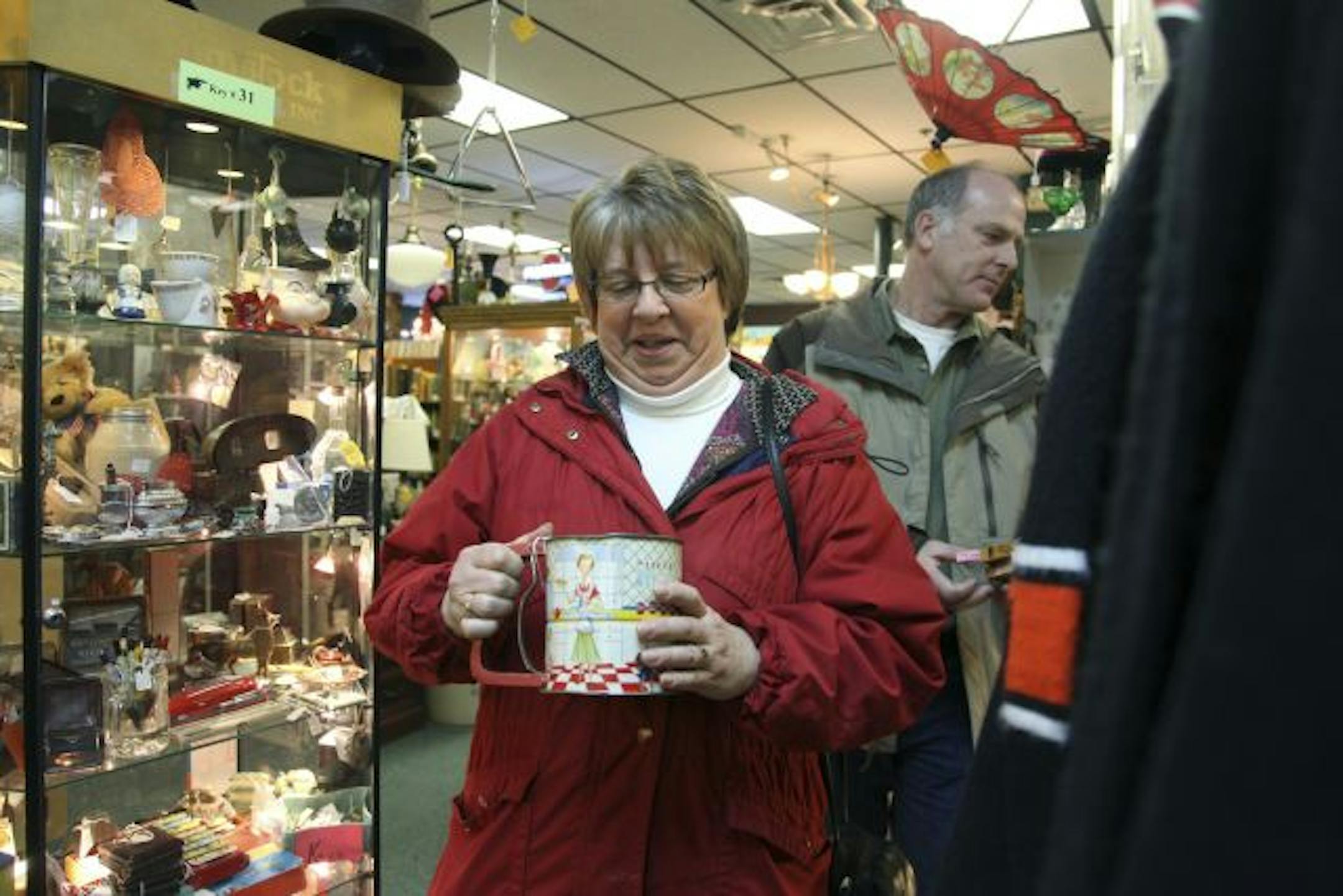 Kathy and Kevin Wilson of Princeton looked at an antique flour sifter at Antiques on Main.