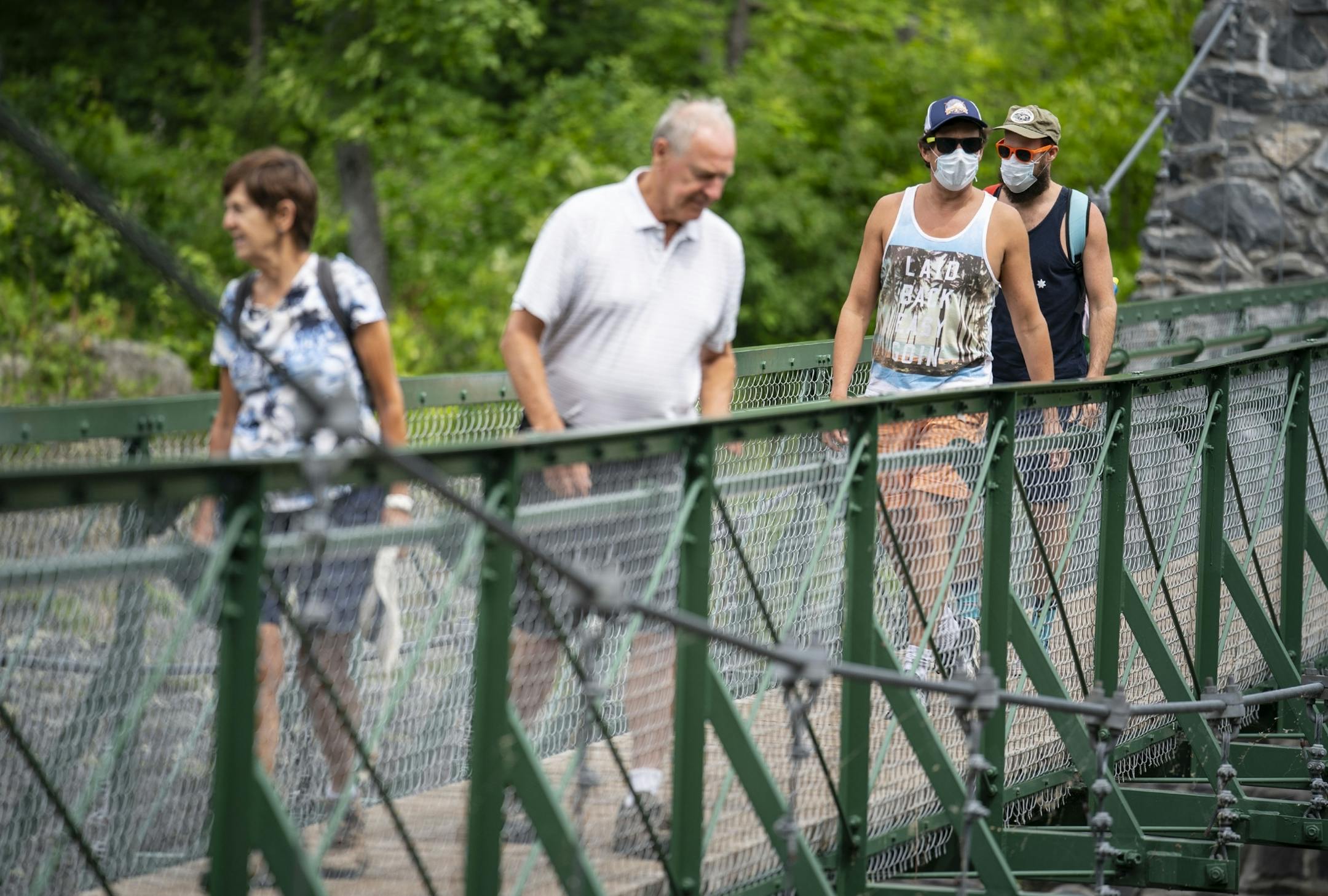 Patsy and Warren Thiede of Bloomington, Minnesota, crossed the swinging bridge while being followed by their son-in-law David Turley and his husband, Peter Thiede, who were visiting from New York on Wednesday.