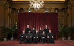 FILE- In this Nov. 30, 2018, file photo the justices of the U.S. Supreme Court gather for a formal group portrait to include a new Associate Justice, 