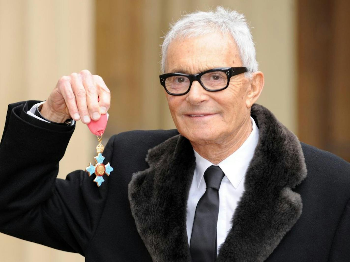 FILE - An Oct. 20, 2009 photo from files showing Vidal Sassoon after he received his Commander of the British Empire medal (CBE) from Queen Elizabeth II at an Investiture ceremony at Buckingham Place, London. Sassoon, whose 1960s wash-and-wear cuts freed women from endless teasing and hairspray died Wednesday, May 9, 2012, at his home. He was 84. )AP Photo/PA, Anthony Devlin, File) UNITED KINGDOM OUT NO SALES NO ARCHIVE