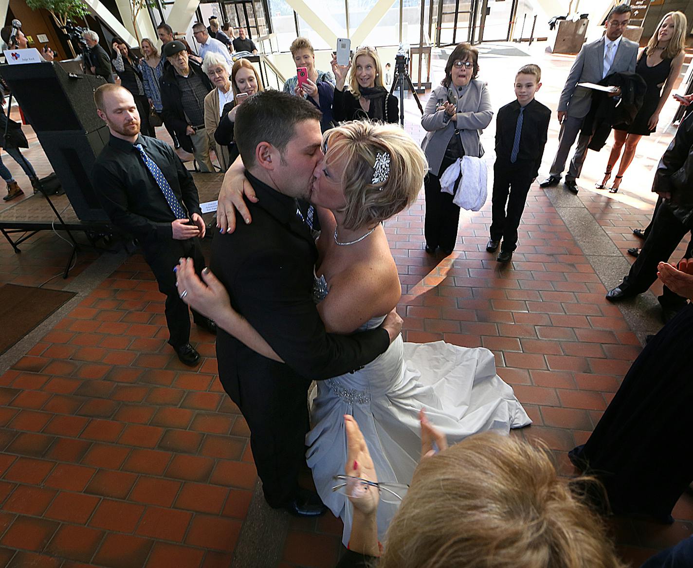 Newlyweds Matt Parker and Stephanie (Cress) Parker kissed during their wedding ceremony. ] JIM GEHRZ &#xef; james.gehrz@startribune.com / Minneapolis, MN / February 12, 2016 /12:00 PM &#xf1; BACKGROUND INFORMATION : Fourth Judicial District judges will unite 34 couples in matrimony at no charge on Friday, February 12, 2016. More than 100 couples have been united at the Valentine&#xed;s Day weekend annual event. A quartet, Musica Ipsa Loquitor, featuring the Honorable Elizabeth Cutter will play t