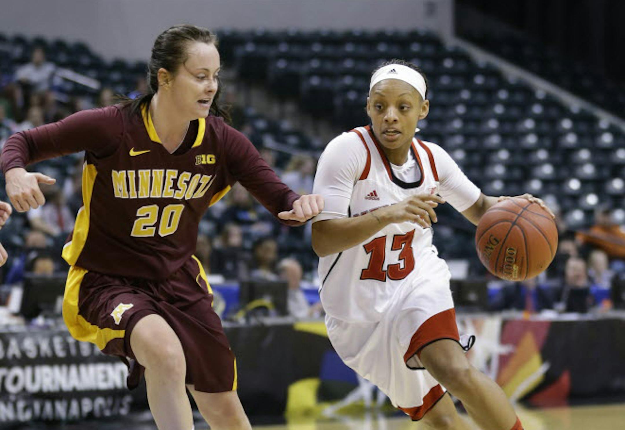 Nebraska guard Brandi Jeffery, right, drives on Minnesota forward Kayla Hirt in the Big Ten women's tournament in Indianapolis, Friday.