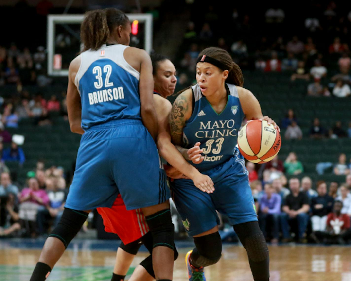 The Minnesota Lynx Rebekkah Brunson (32) sets a pick for Seimone Augustus (33) against he Washington Mystic's Kristin Toliver, center during the second quarter Friday, June 22, 2017, at the Xcel Energy Center in St. Paul, MN.]