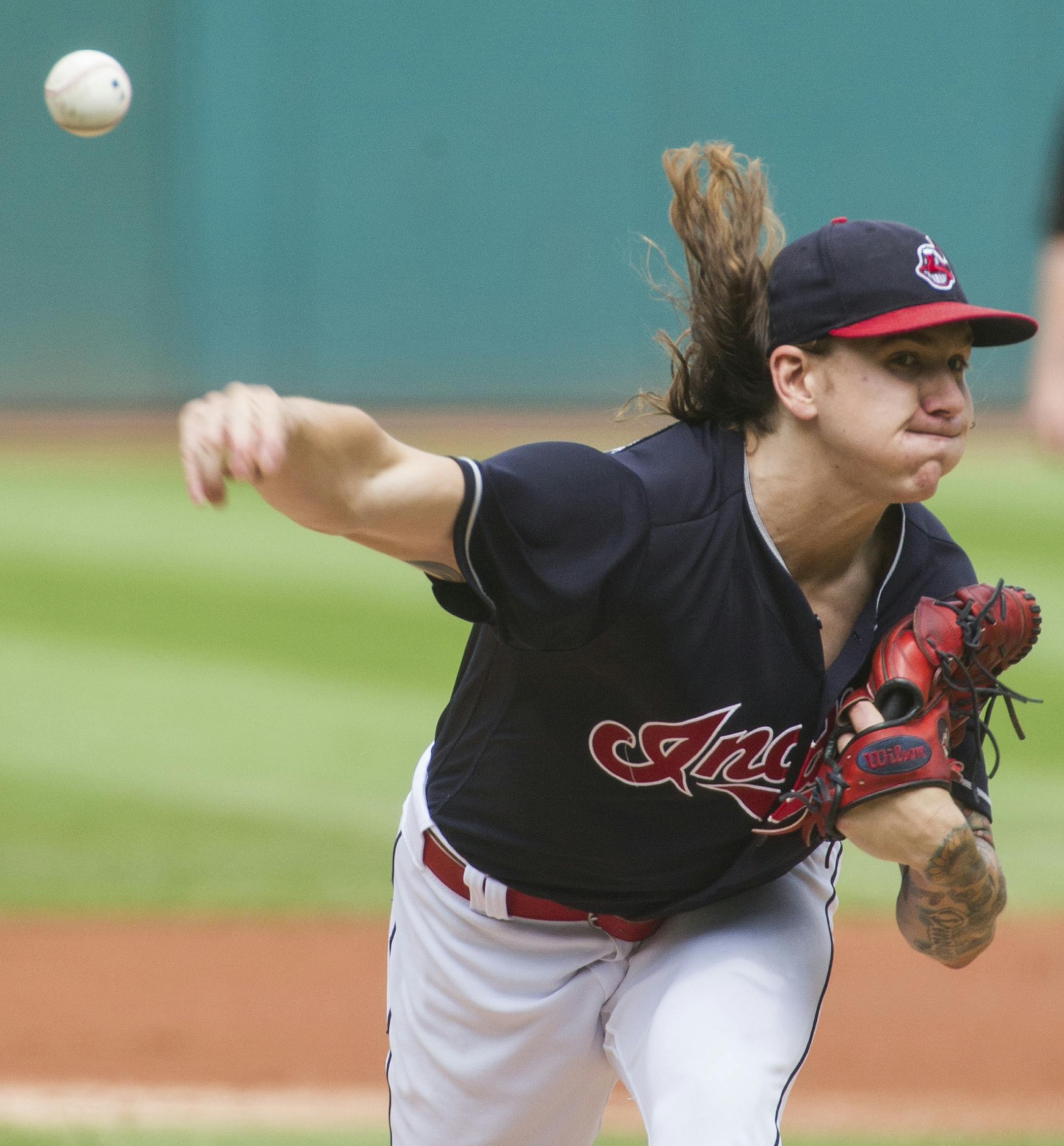 Cleveland Indians starting pitcher Mike Clevinger delivers to Minnesota Twins' Joe Mauer during the first inning of a baseball game in Cleveland, Thursday, Aug. 30, 2018. (AP Photo/Phil Long)