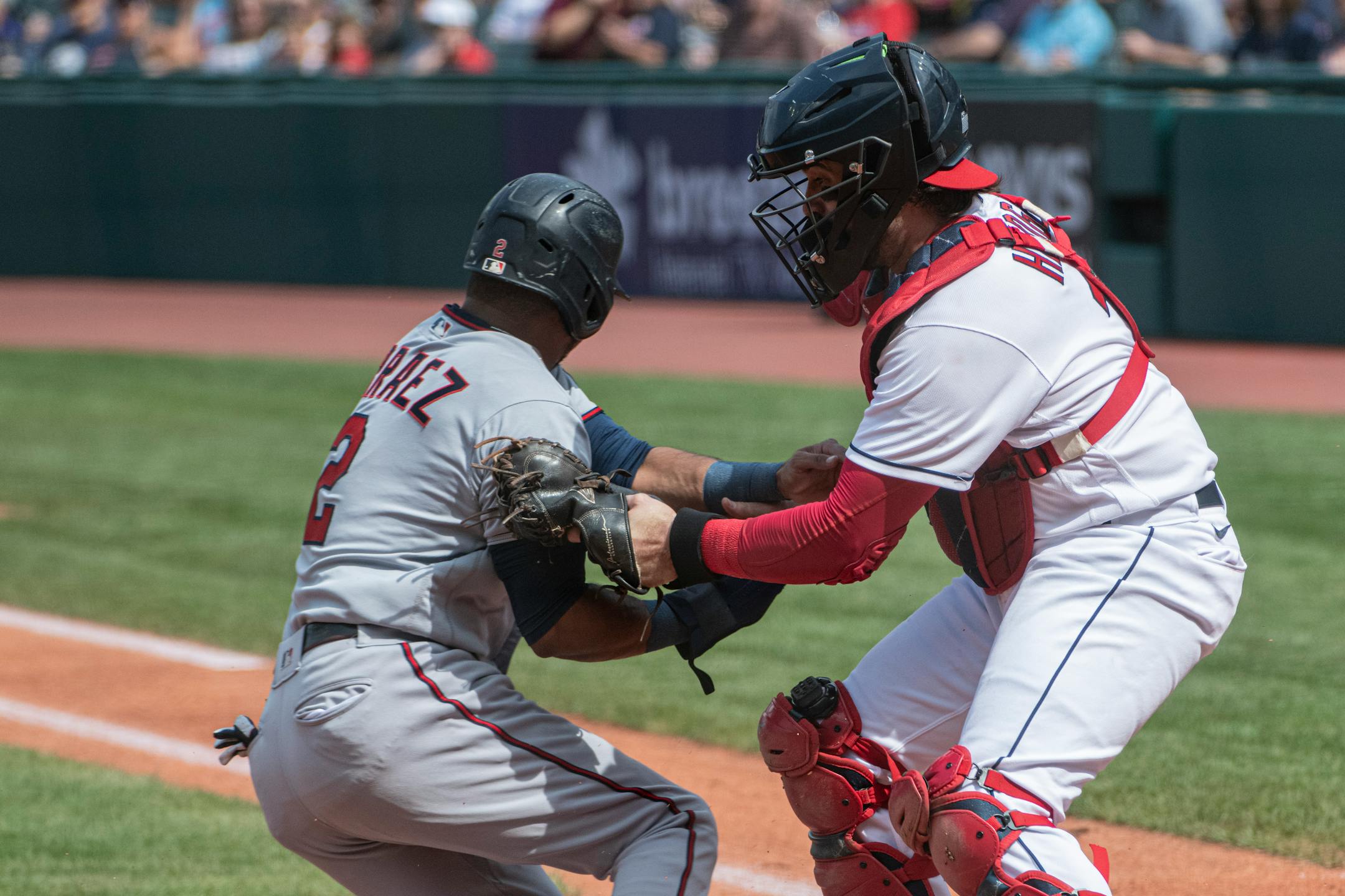 Cleveland Guardians' Austin Hedges tags out Minnesota Twins' Luis Arraez during the first inning of a baseball game in Cleveland, Sunday, Sept. 18, 2022. (AP Photo/Phil Long)