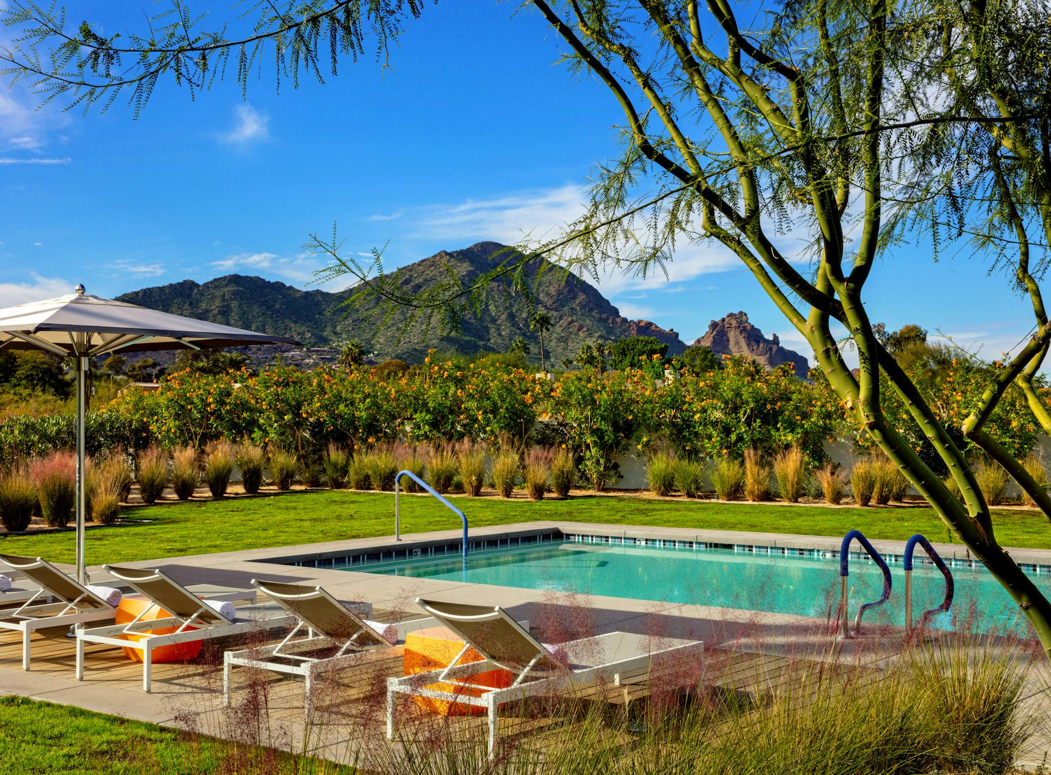 -- PHOTO MOVED IN ADVANCE AND NOT FOR USE - ONLINE OR IN PRINT - BEFORE AUG. 4, 2019. -- In a photo provided by Andaz Scottsdale Resort & Bungalows, the pool at the Andaz Scottsdale Resort & Bungalows, in Scottsdale, Ariz. Pools, spas and air-conditioned luxury with stunning views are a bargain at these desert resorts. (Andaz Scottsdale Resort & Bungalows via The New York Times) -- NO SALES; FOR EDITORIAL USE ONLY WITH NYT STORY FRUGAL TRAVELER BY JULIE HALPERT FOR AUG. 2, 2019. ALL OTHER USE PR