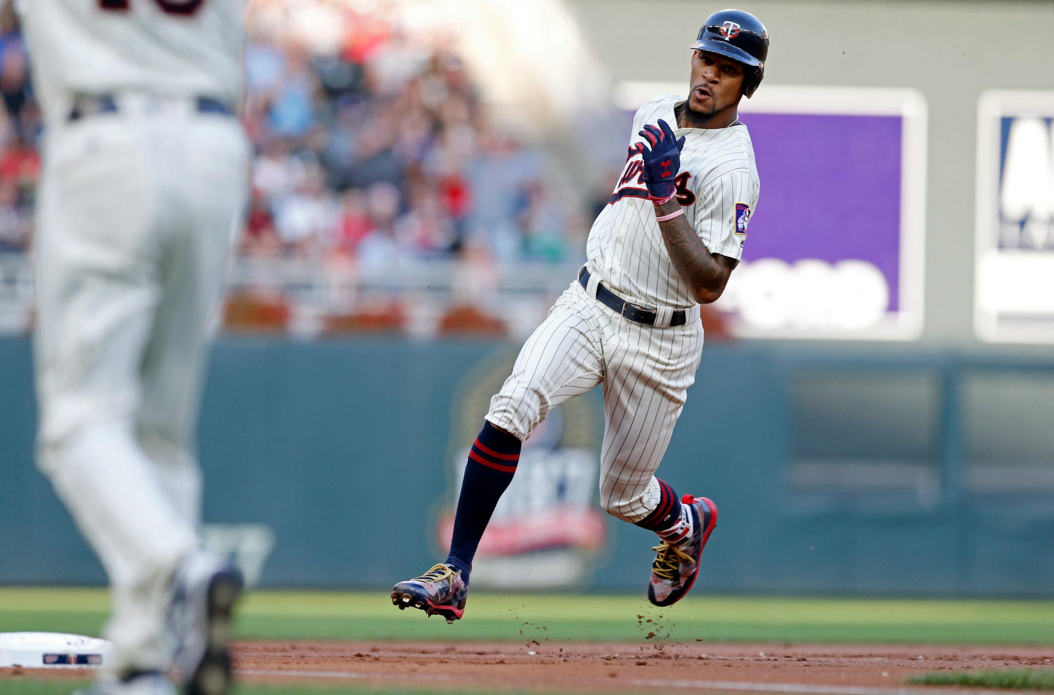 Minnesota Twins' Byron Buxton heads for third on an RBI triple off Kansas City Royals pitcher Onelki Garcia in the first inning of a baseball game Saturday, Sept, 2, 2017, in Minneapolis. (AP Photo/Jim Mone)