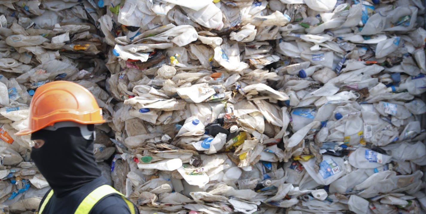 In this Tuesday, May 28, 2019, file photo, a container is filled with plastic waste from Australia, in Port Klang, Malaysia. Malaysia says it will send back some 3,000 metric tonnes (330 tons) of non-recyclable plastic waste to countries including the U.S., U.K., Canada and Australia in a move to avoid becoming a dumping ground for rich nations. (AP Photo /Vincent Thian, File)