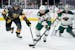 Minnesota Wild left wing Joseph Cramarossa (56) and Vegas Golden Knights right wing Keegan Kolesar (55) vie for the puck during the second period of a