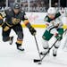 Minnesota Wild left wing Joseph Cramarossa (56) and Vegas Golden Knights right wing Keegan Kolesar (55) vie for the puck during the second period of a