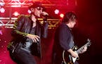 Chester Bennington, left, and Dean DeLeo of the band Stone Temple Pilots perform in concert during the 2015 Shindig Music Festival at Carroll Park on 