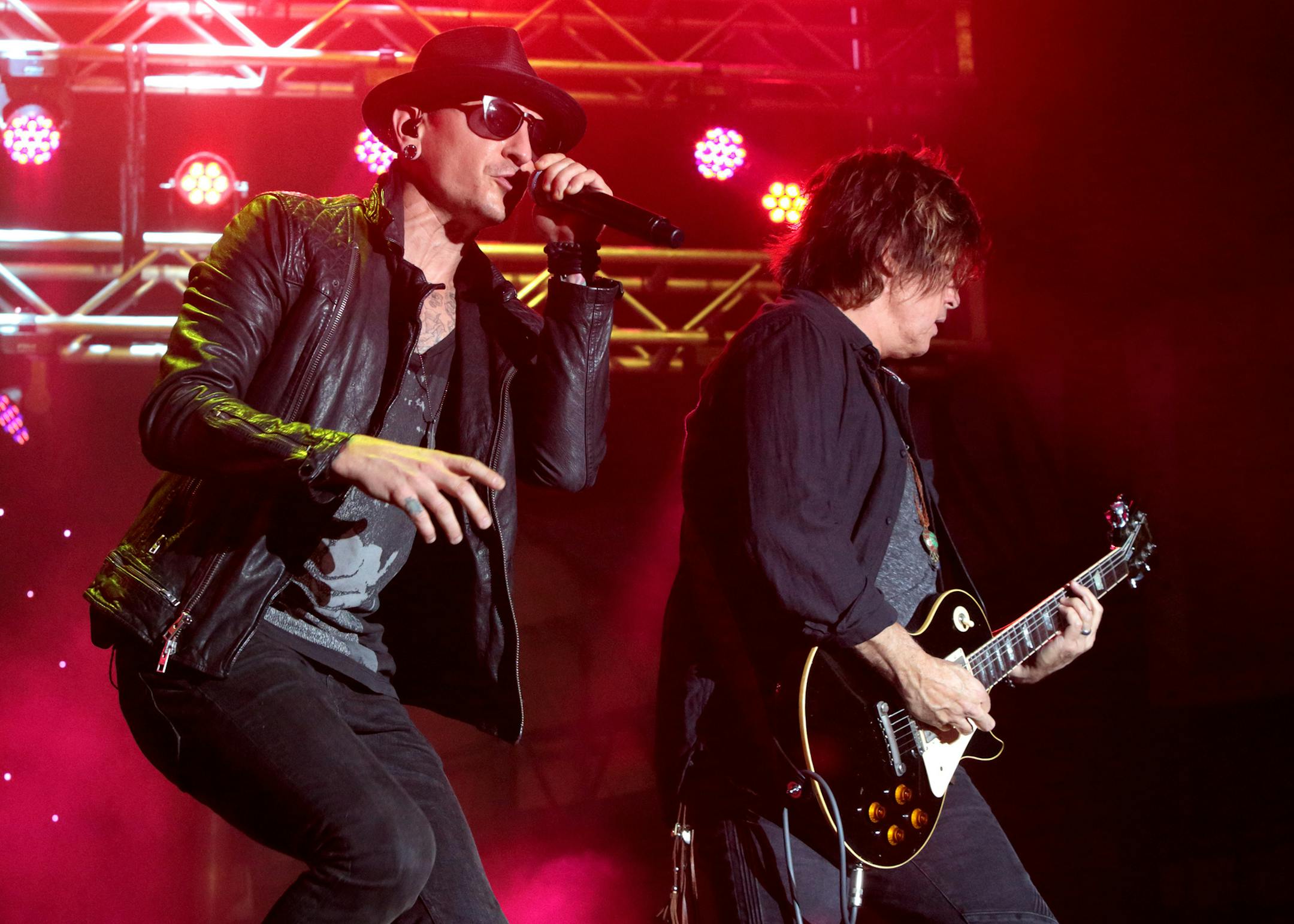 Chester Bennington, left, and Dean DeLeo of the band Stone Temple Pilots perform in concert during the 2015 Shindig Music Festival at Carroll Park on Saturday, Sept. 19, 2015, in Baltimore. (Photo by Owen Sweeney/Invision/AP)