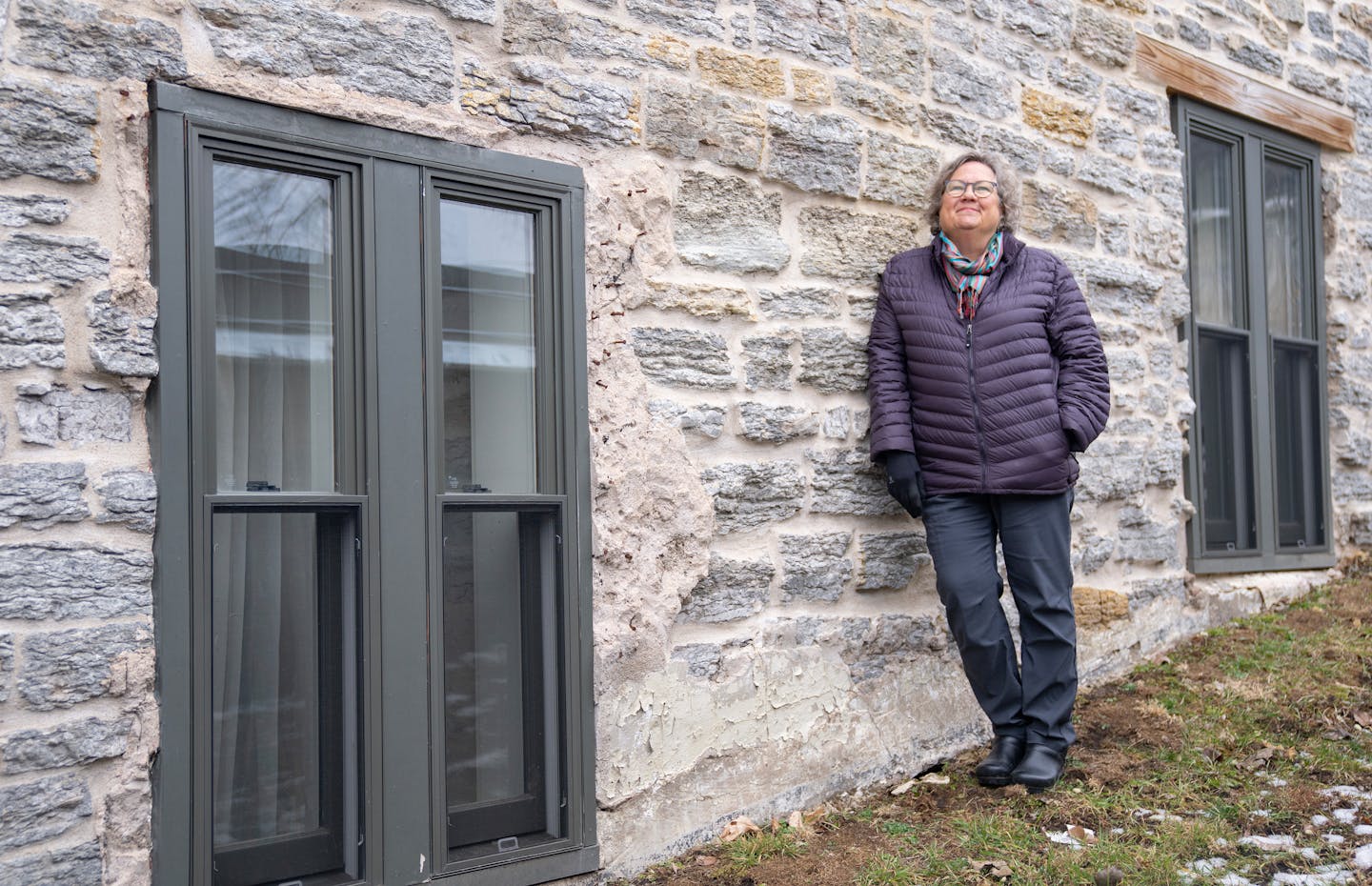 Carol Carey is retiring as executive director at Historic St. Paul. She stood outside a home from the 1850s that Carey helped redevelop into apartment