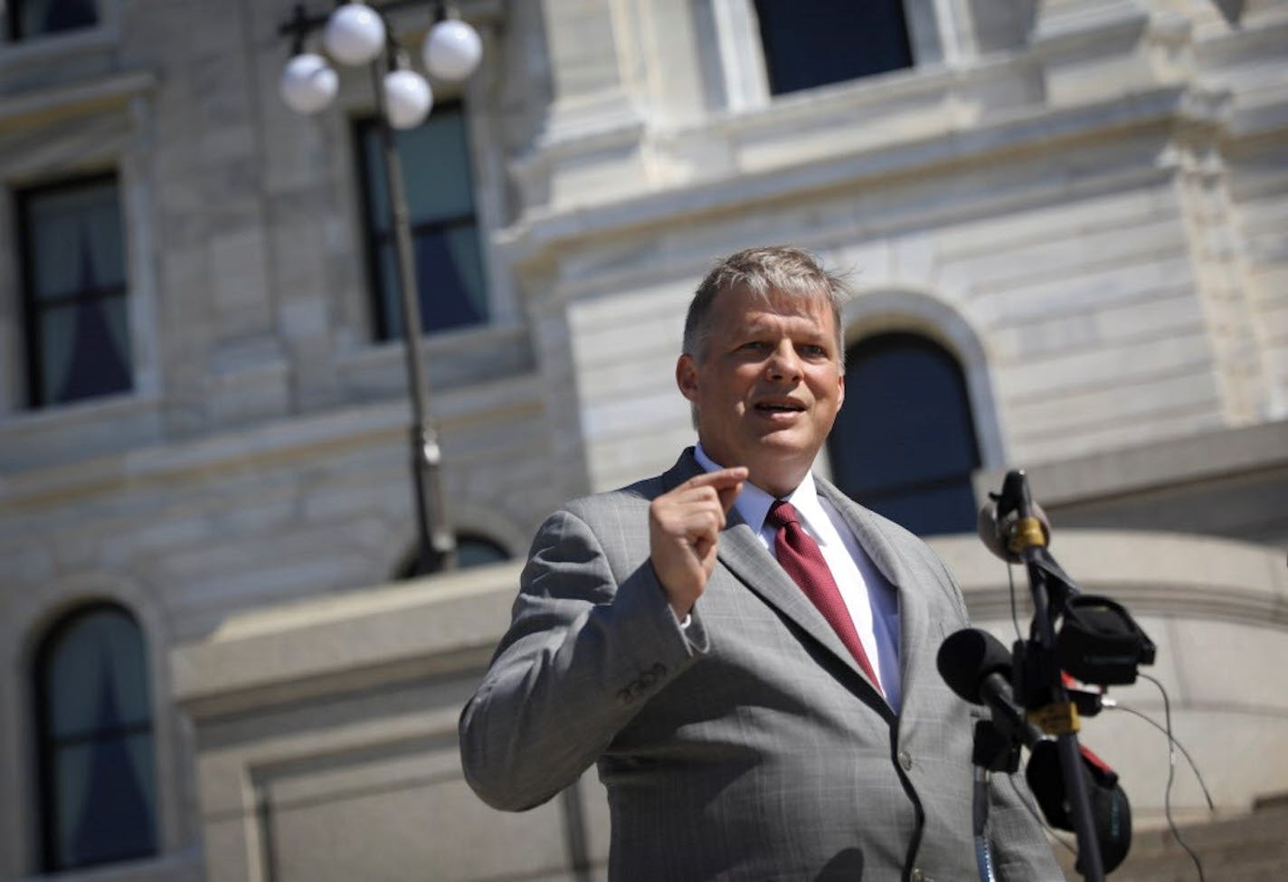 Mohrman, Kaardal & Erickson Attorney Erick Kaardal announces the filing of the lawsuit at the State Capitol in St. Paul, Minn., on Monday, June 5, 2017.