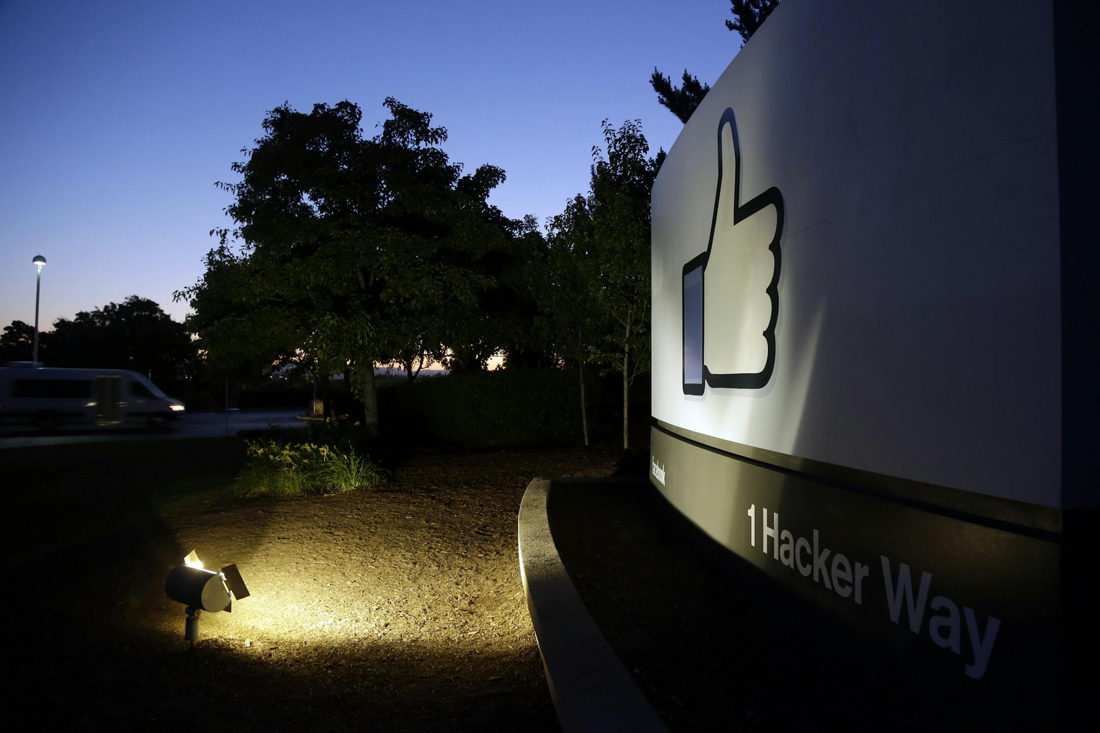 The Facebook "like" symbol is illuminated on a sign outside the company's headquarters in Menlo Park, Calif., Friday, June 7, 2013. A leaked document has laid bare the monumental scope of the government's surveillance of Americans' phone records ó hundreds of millions of calls ó in the first hard evidence of a massive data collection program aimed at combating terrorism under powers granted by Congress after the 9/11 attacks. The companies include Microsoft, Yahoo, Google, Facebook, Pa